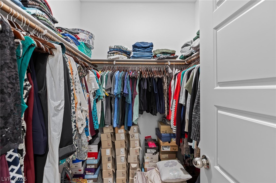 7310 North Decatur Boulevard, Unit 4 North Las Vegas, NV 89084 - Photo 16 of 35 Well-appointed walk-in closet offers ample storage and organization for an extensive wardrobe.