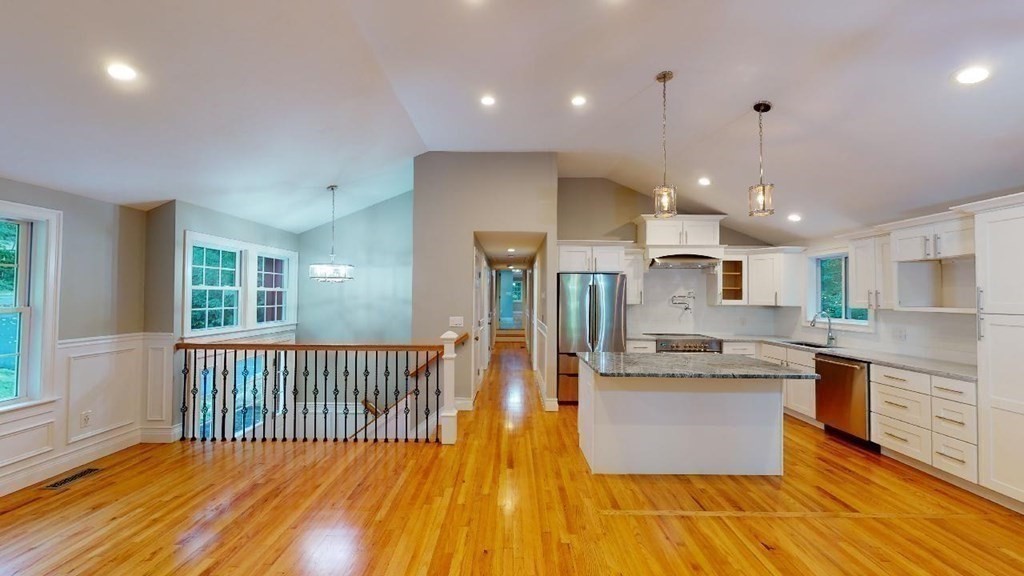 105 Purgatory Road Sutton, MA 01590 - Photo 1 of 42 a view of a kitchen with kitchen island a large counter top space a sink stainless steel appliances and cabinets