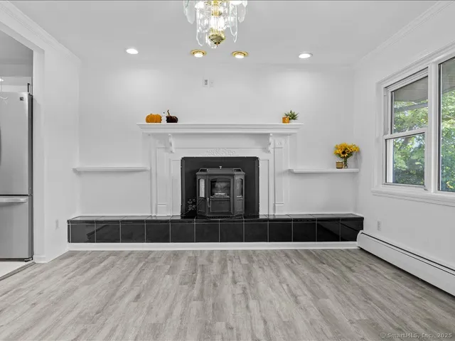 a view of kitchen and hall with wooden floor
