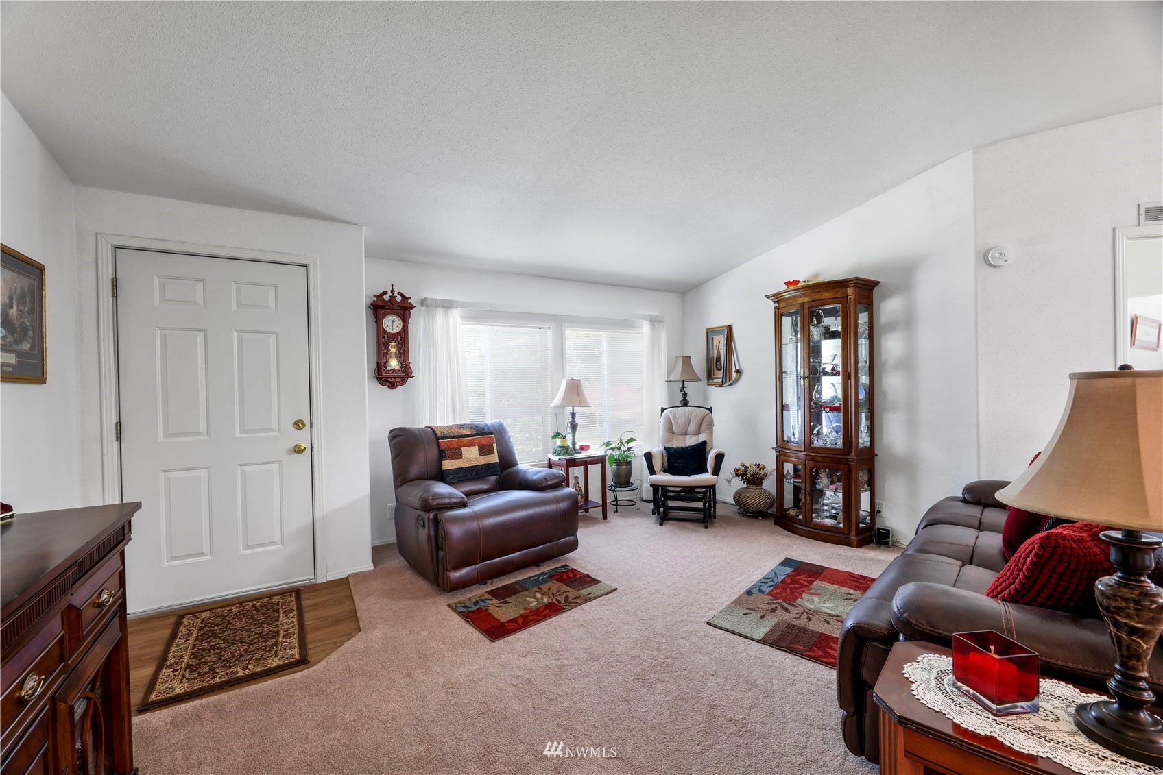 1761 Kaas Road Ferndale, WA 98248 - Photo 11 of 22 a living room with furniture a flat screen tv and gym equipment