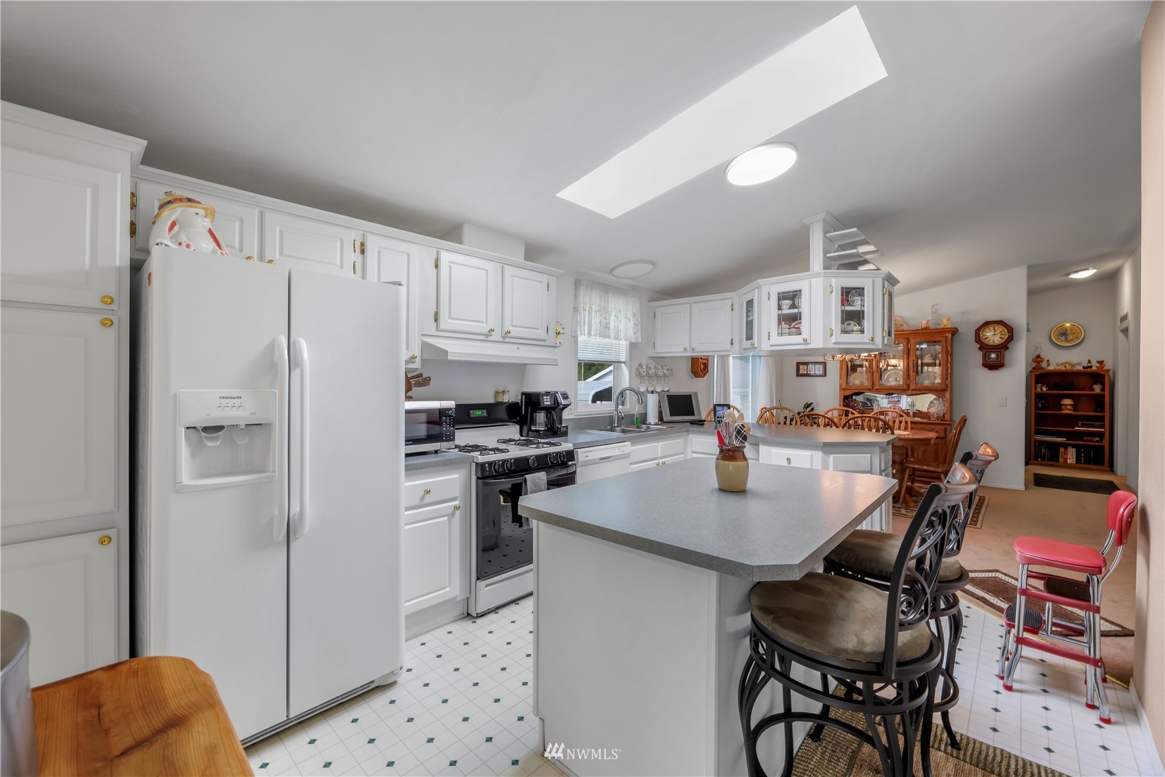 1761 Kaas Road Ferndale, WA 98248 - Photo 14 of 22 a kitchen with stainless steel appliances kitchen island granite countertop a refrigerator and a stove top oven