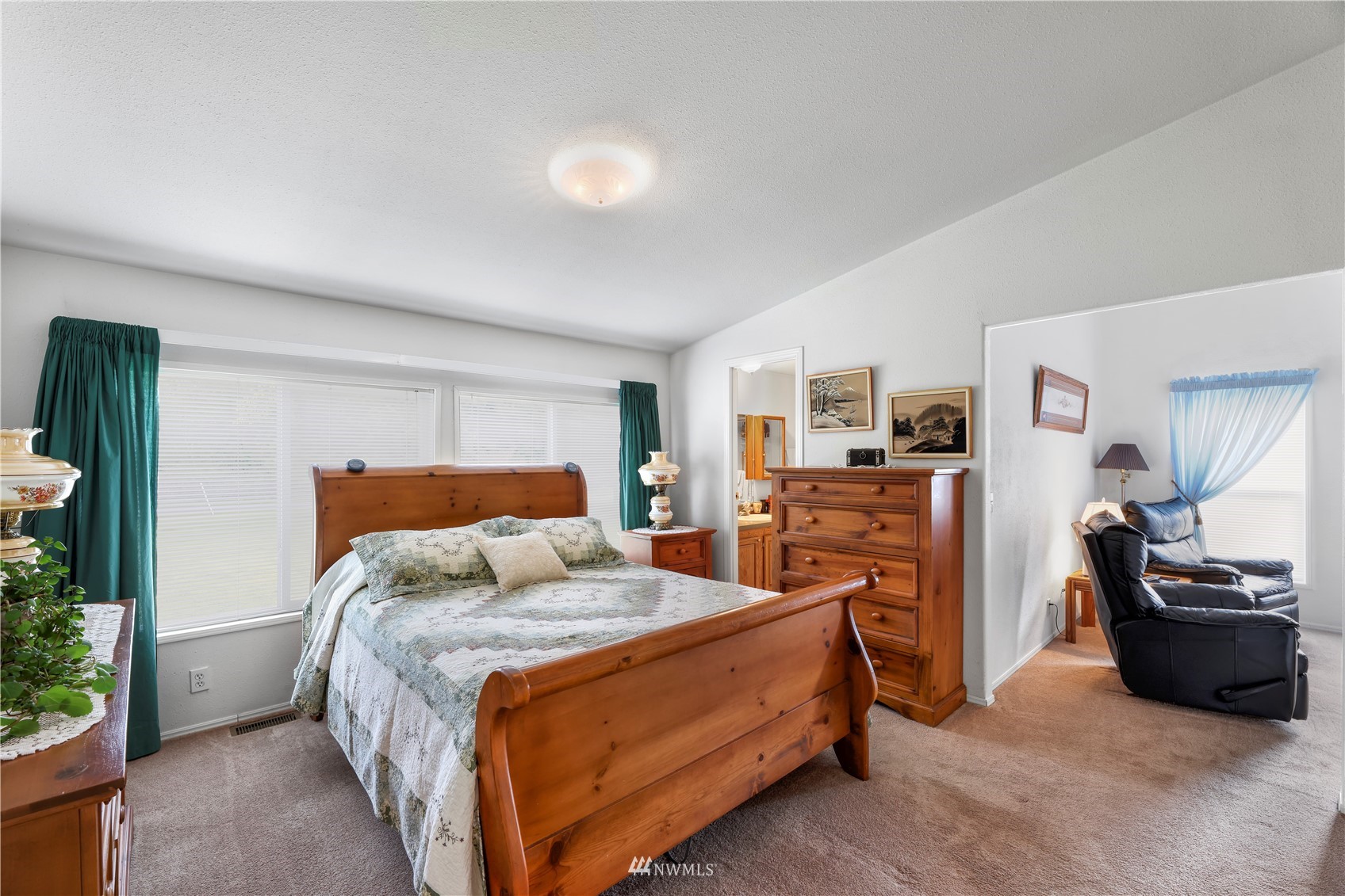 1761 Kaas Road Ferndale, WA 98248 - Photo 17 of 22 a bedroom with a bed a flat screen tv and dresser