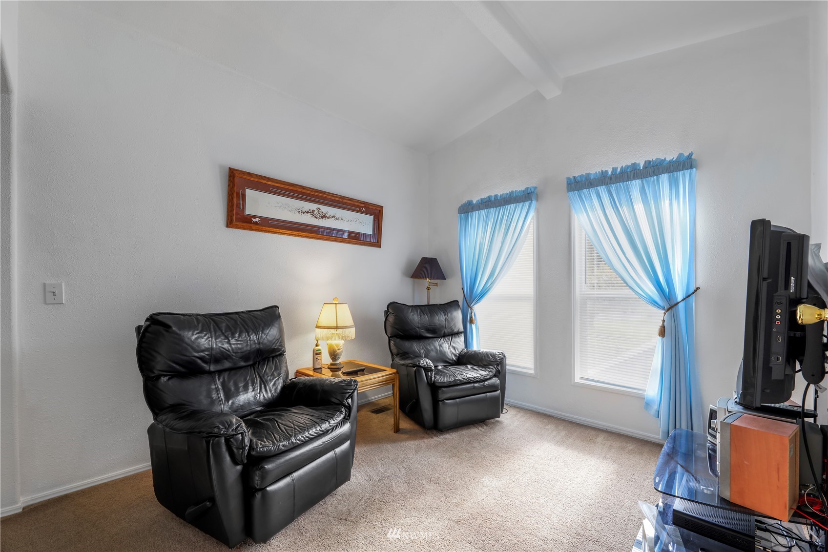 1761 Kaas Road Ferndale, WA 98248 - Photo 18 of 22 a living room with furniture a flat screen tv and a window