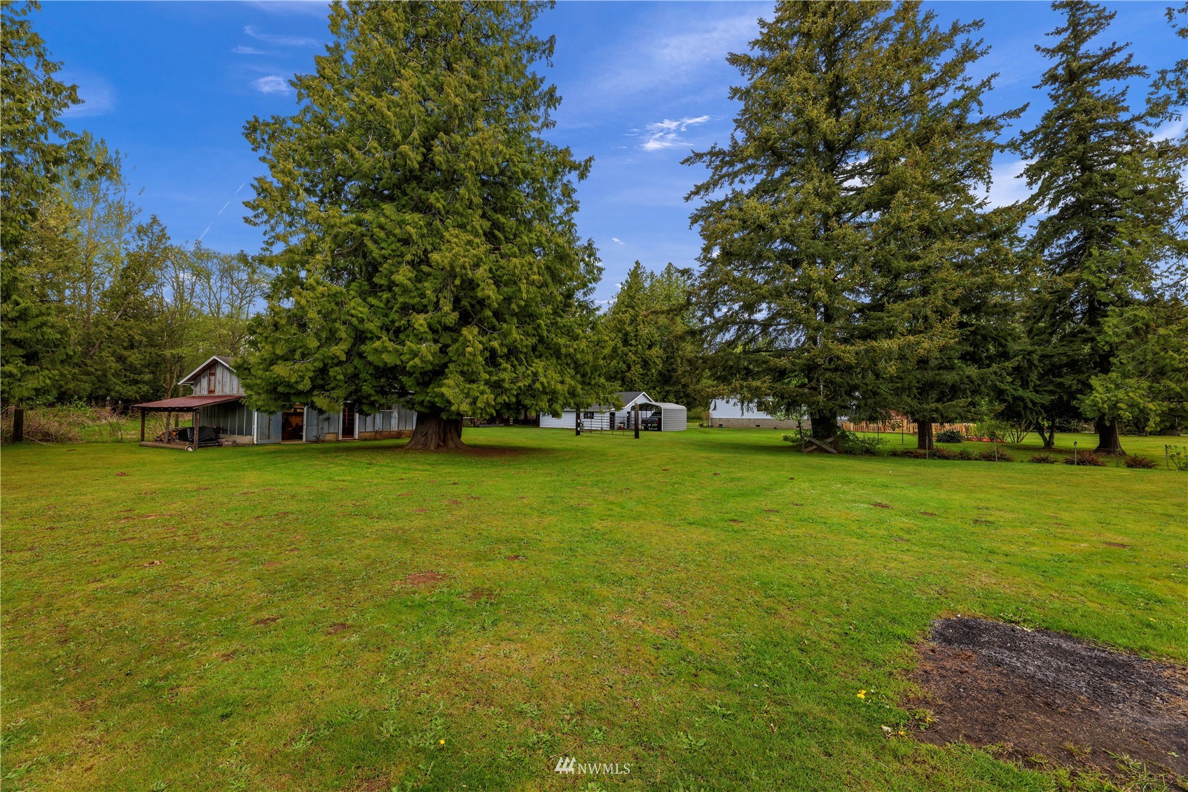 1761 Kaas Road Ferndale, WA 98248 - Photo 3 of 22 a view of a trees in front of a house