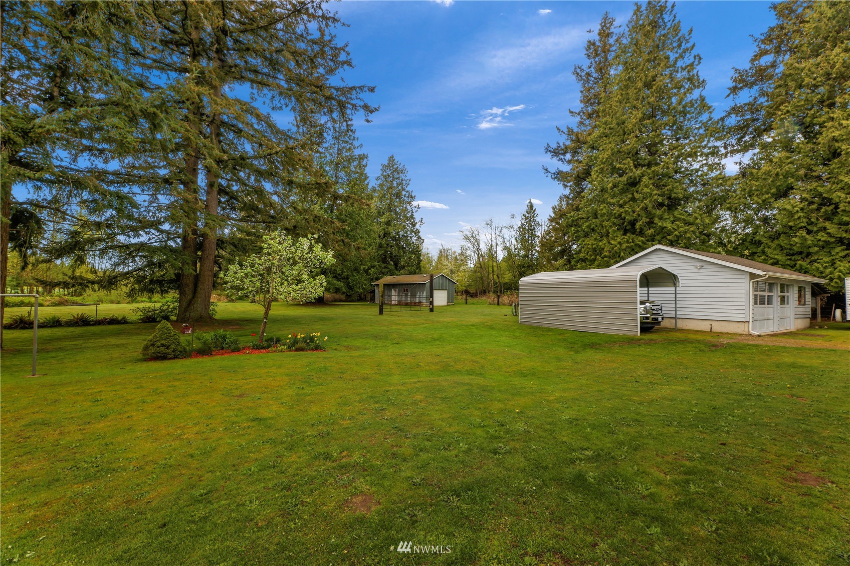 1761 Kaas Road Ferndale, WA 98248 - Photo 6 of 22 a white house with a big yard and large trees