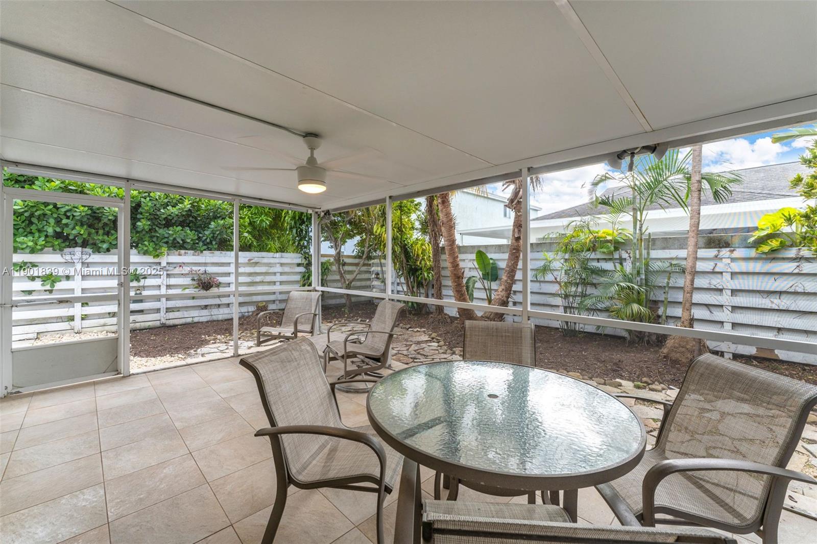 14512 Southwest 138th Court Miami, FL 33186 - Photo 22 of 28 a dining room with furniture and large windows