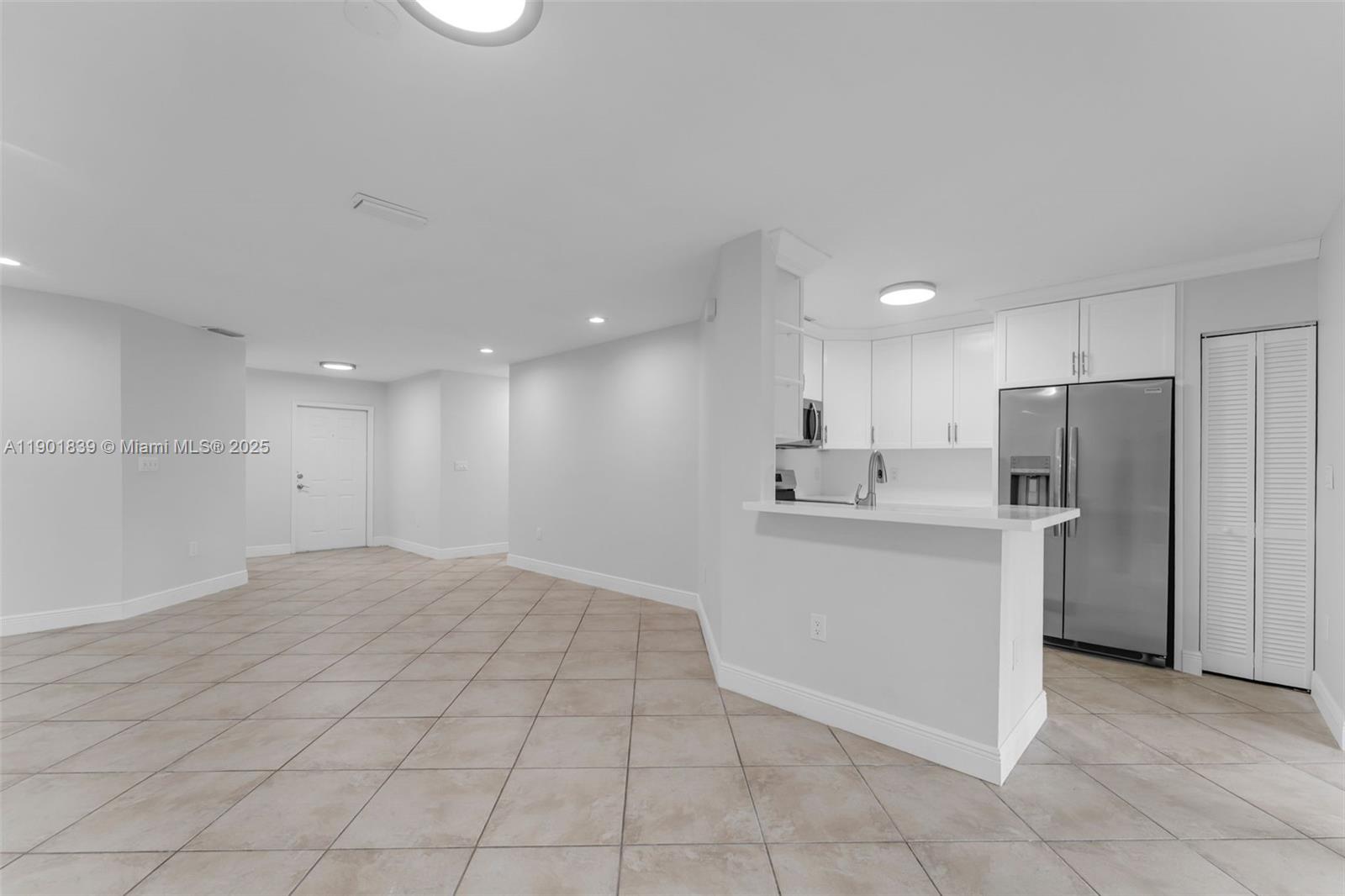 14512 Southwest 138th Court Miami, FL 33186 - Photo 7 of 28 a view of kitchen with refrigerator cabinets and a sink