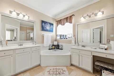 a bathroom with a sink vanity and mirror