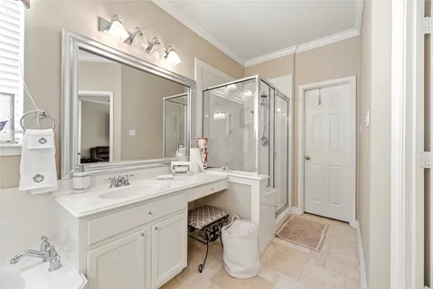 a bathroom with a sink vanity and a mirror