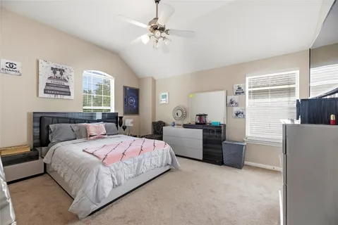 a bedroom with a bed furniture and a window