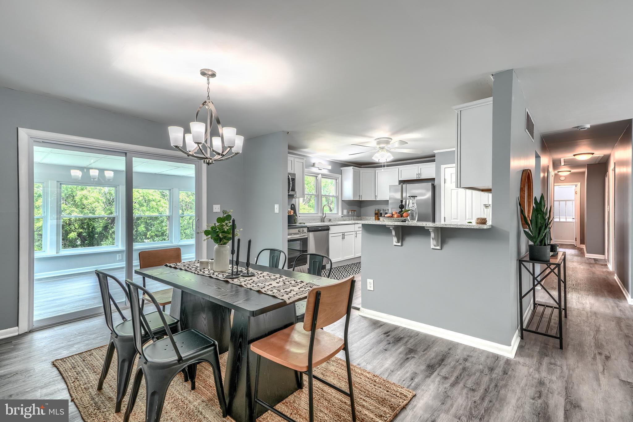 8020 Redstone Road Kingsville, MD 21087 - Photo 12 of 50 a view of a dining room with furniture window and wooden floor