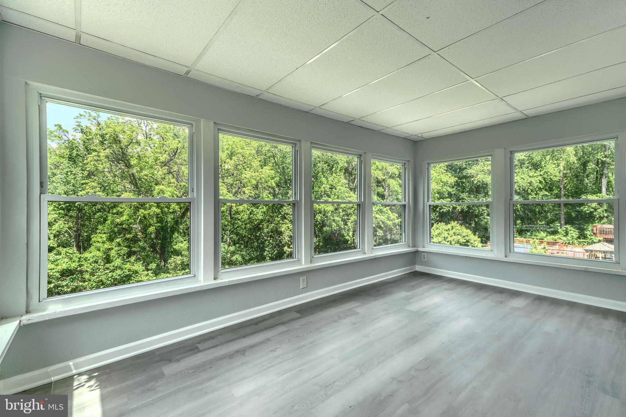 8020 Redstone Road Kingsville, MD 21087 - Photo 21 of 50 a view of empty room with green walls and large window