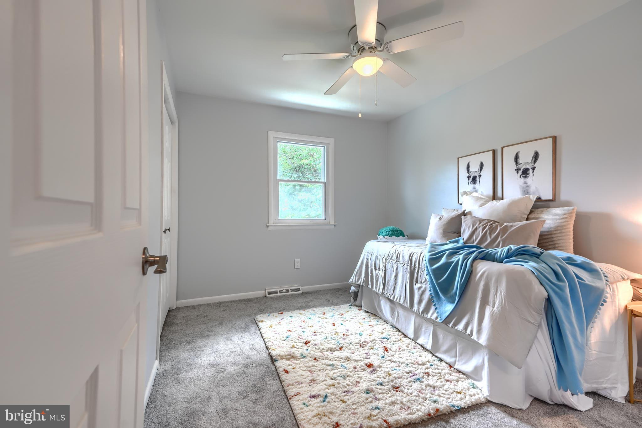8020 Redstone Road Kingsville, MD 21087 - Photo 23 of 50 a bedroom with a bed and a window