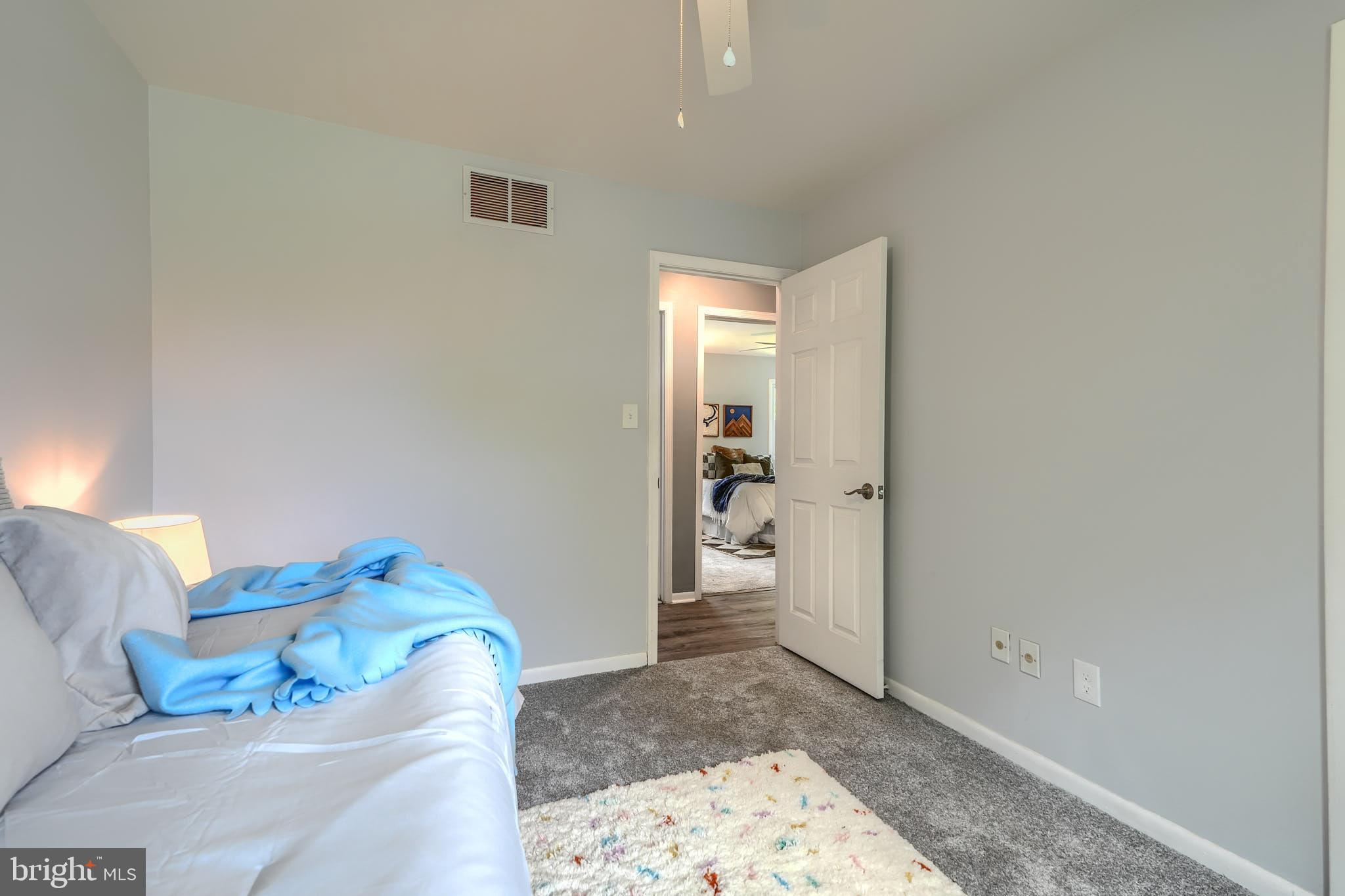 8020 Redstone Road Kingsville, MD 21087 - Photo 24 of 50 a living room with a couch and a rug