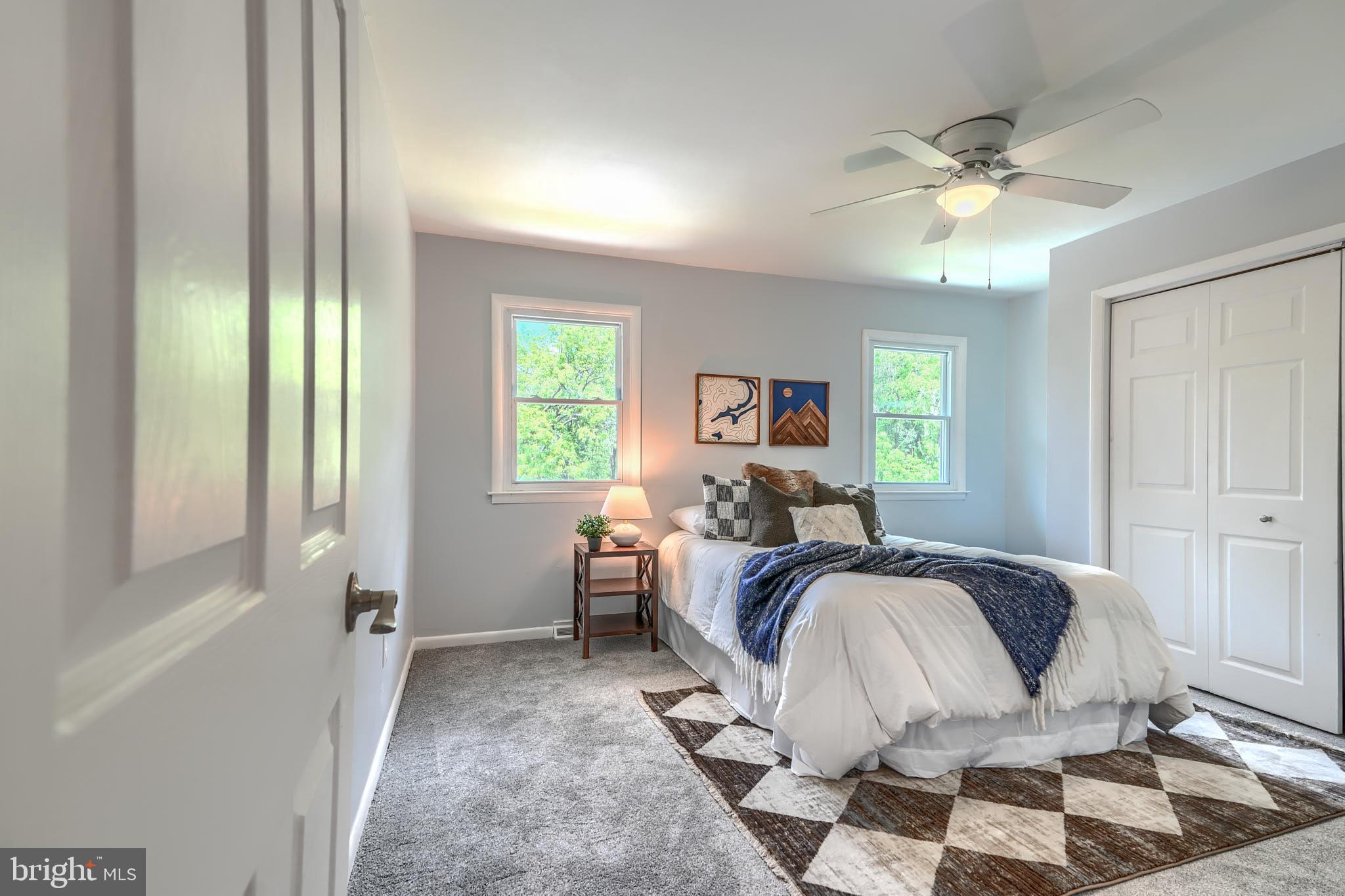 8020 Redstone Road Kingsville, MD 21087 - Photo 25 of 50 a bed room with a bed and a chandelier