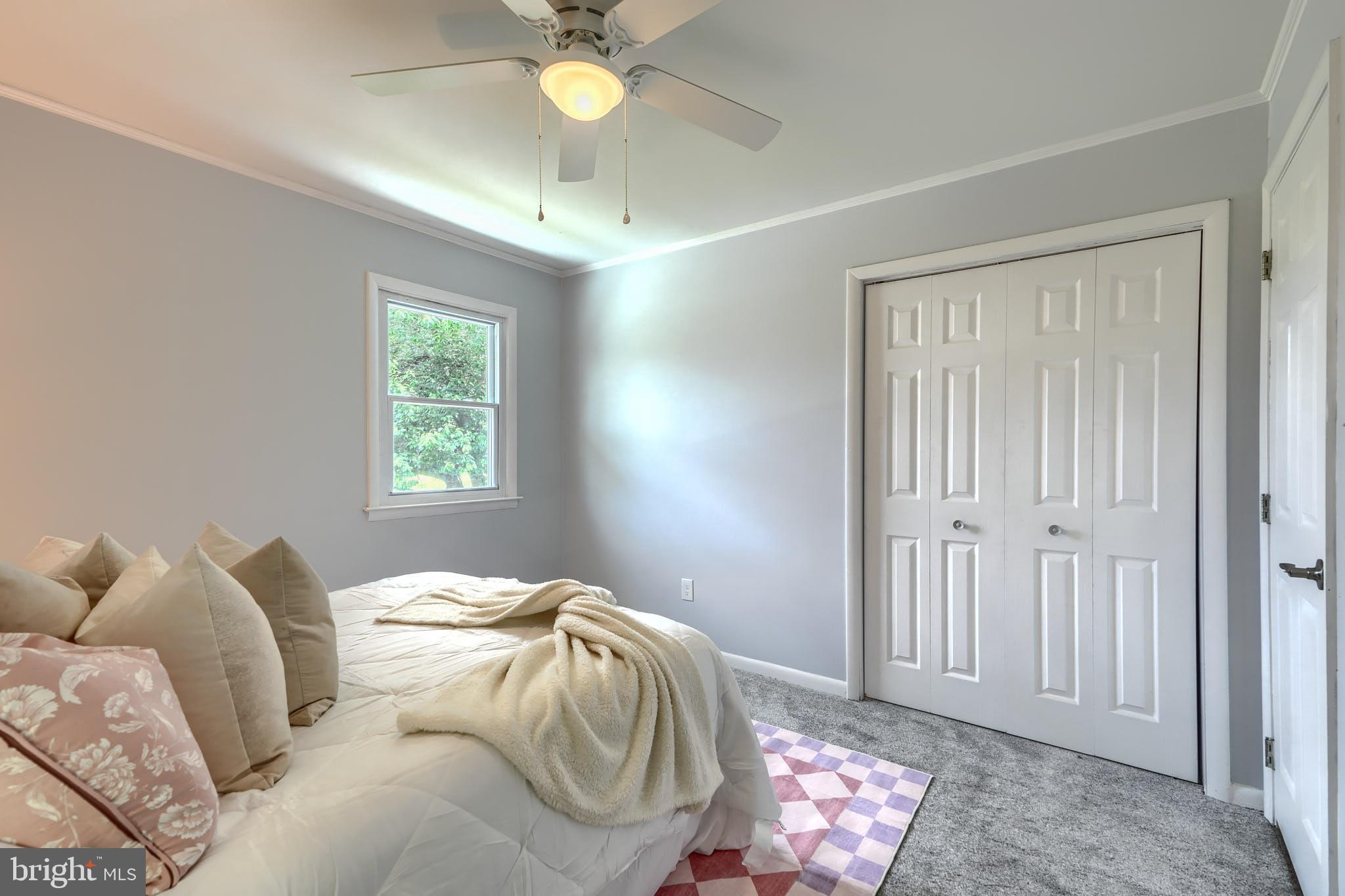 8020 Redstone Road Kingsville, MD 21087 - Photo 28 of 50 a bedroom with a bed and a chandelier