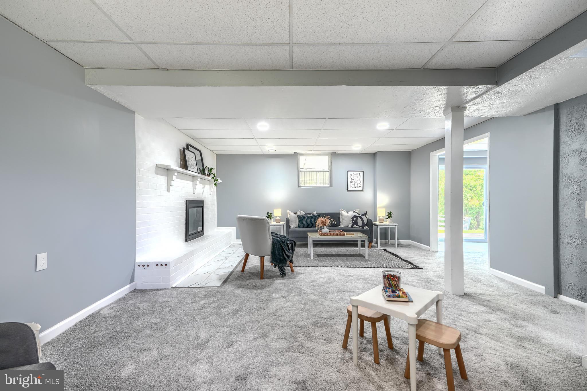 8020 Redstone Road Kingsville, MD 21087 - Photo 38 of 50 a living room with furniture and a dining table with wooden floor
