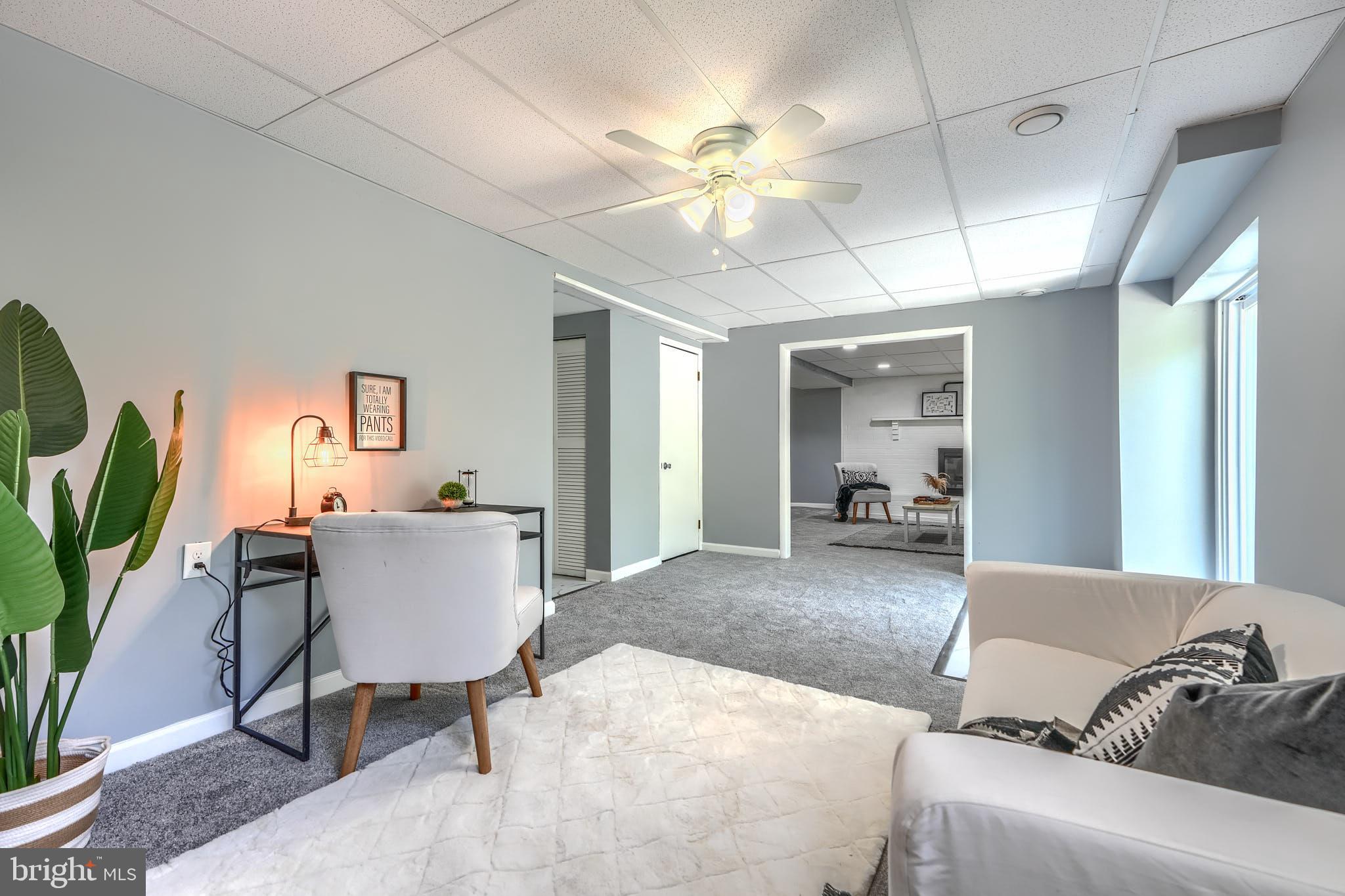 8020 Redstone Road Kingsville, MD 21087 - Photo 40 of 50 a living room with furniture and a chandelier