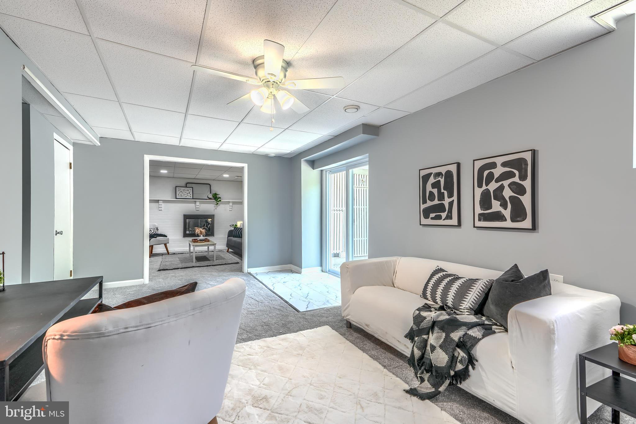 8020 Redstone Road Kingsville, MD 21087 - Photo 41 of 50 a living room with furniture and a chandelier