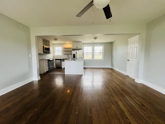 a view of kitchen and dining room with wooden floor