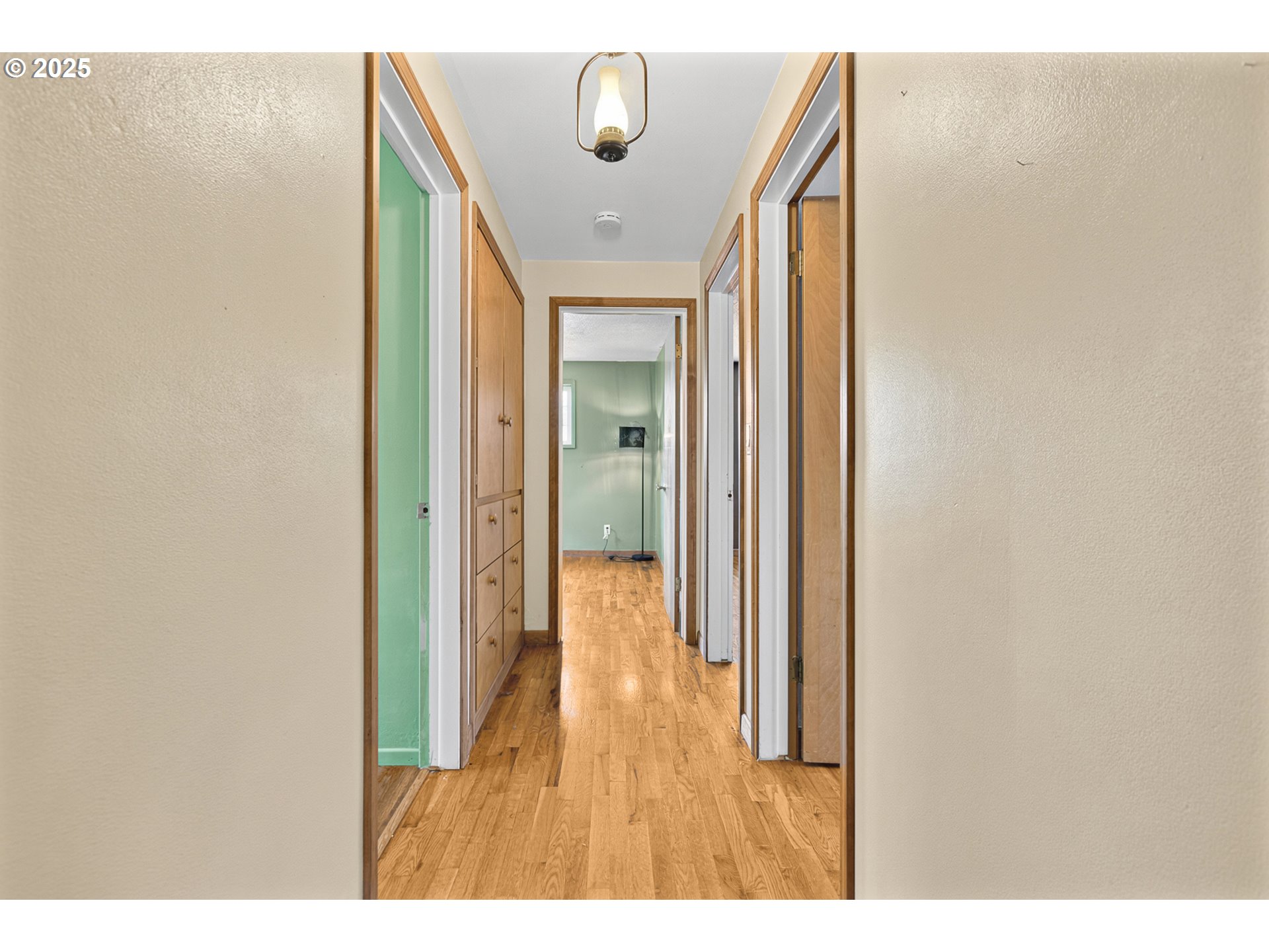 457 Archie Street Eugene, OR 97402 - Photo 20 of 48 a view of a hallway with wooden floor