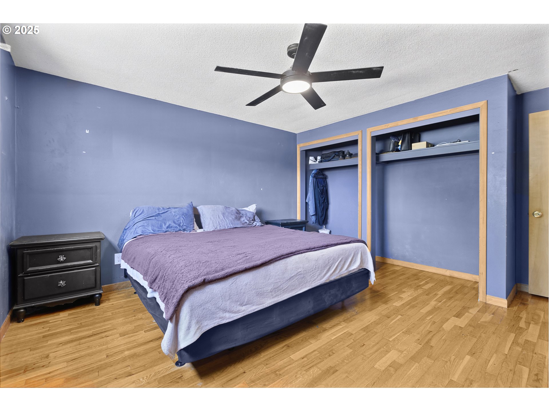 457 Archie Street Eugene, OR 97402 - Photo 21 of 48 a bedroom with a bed and a ceiling fan