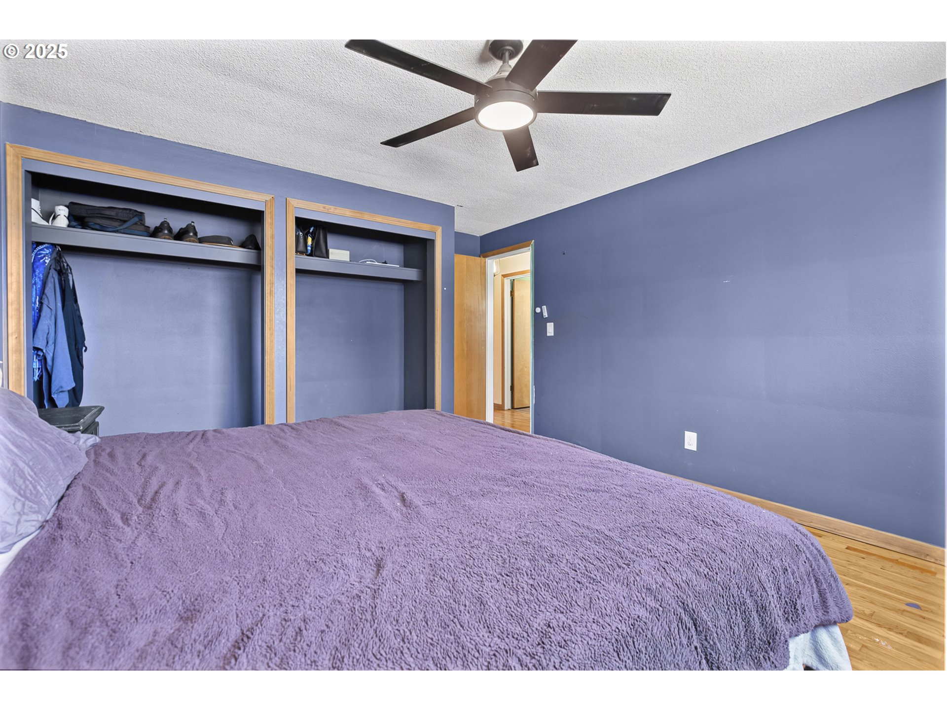 457 Archie Street Eugene, OR 97402 - Photo 23 of 48 a bedroom with a bed and a ceiling fan