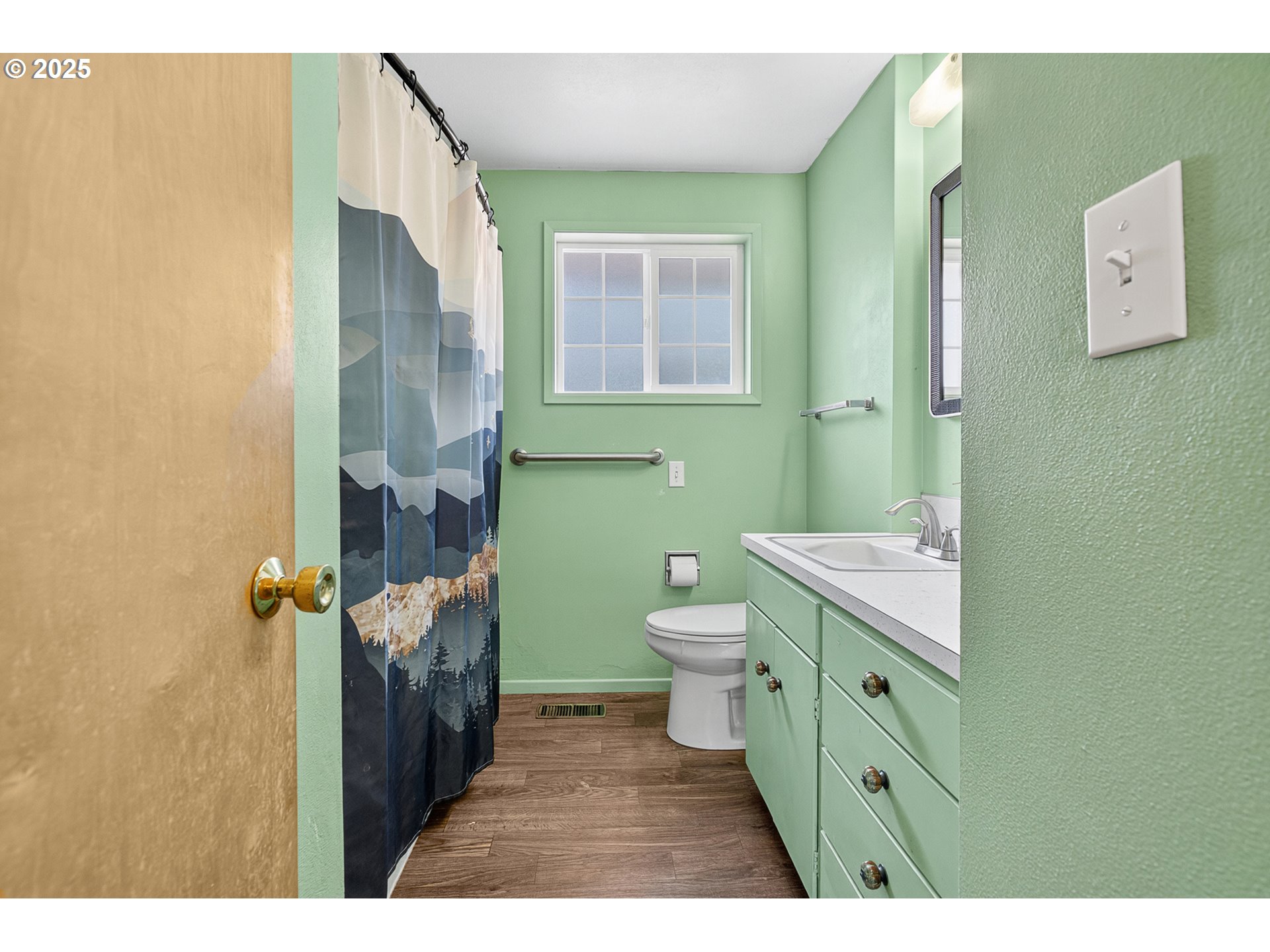 457 Archie Street Eugene, OR 97402 - Photo 26 of 48 a bathroom with a toilet sink and mirror