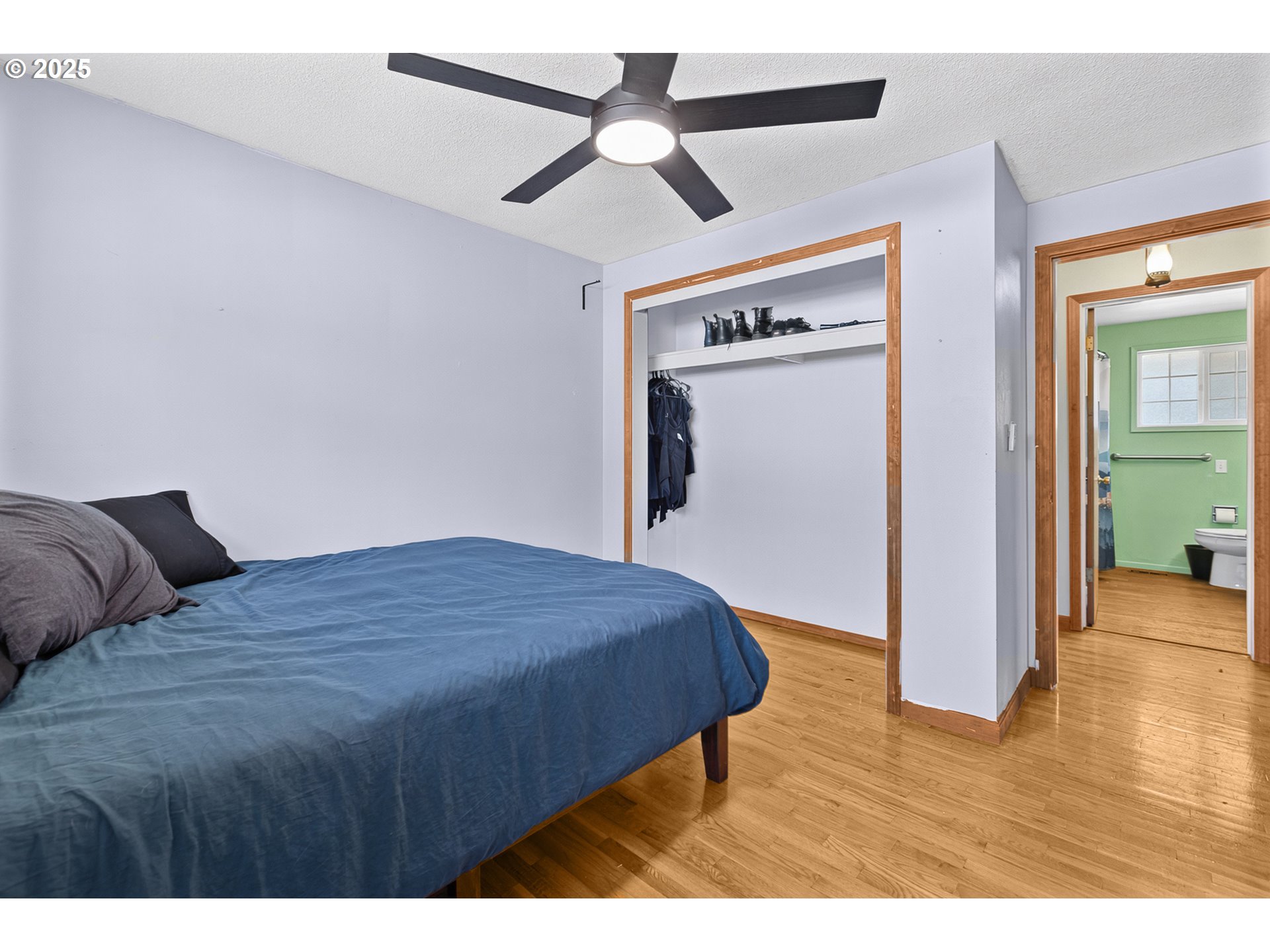 457 Archie Street Eugene, OR 97402 - Photo 28 of 48 a bedroom with a bed and a ceiling fan