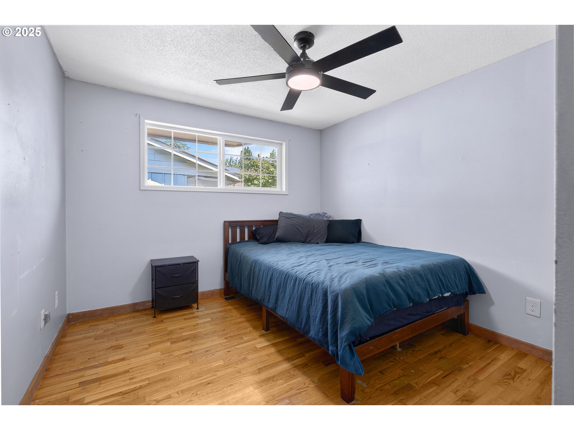 457 Archie Street Eugene, OR 97402 - Photo 29 of 48 a bedroom with a bed and a ceiling fan