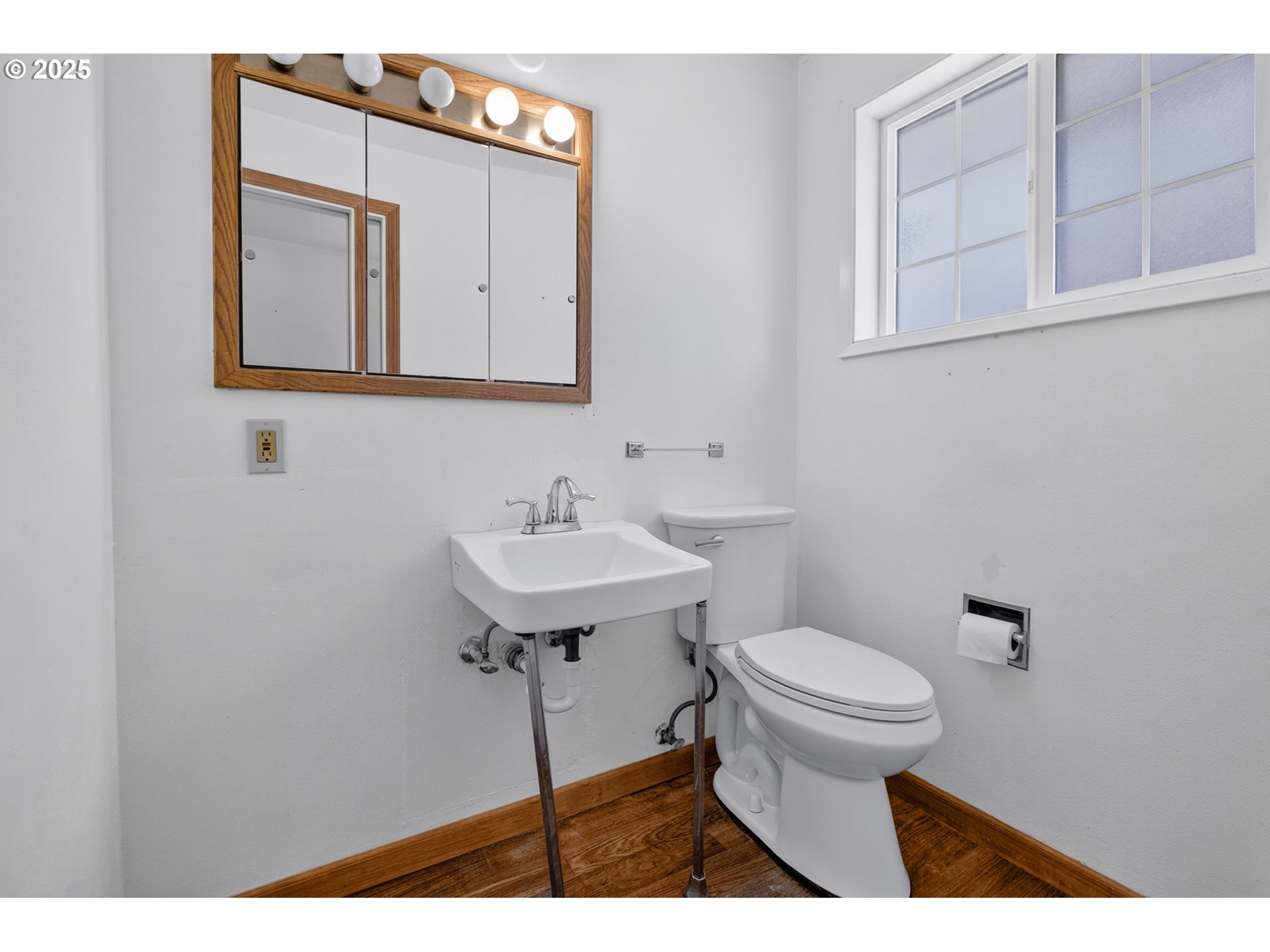 457 Archie Street Eugene, OR 97402 - Photo 34 of 48 a bathroom with a sink a mirror and a toilet