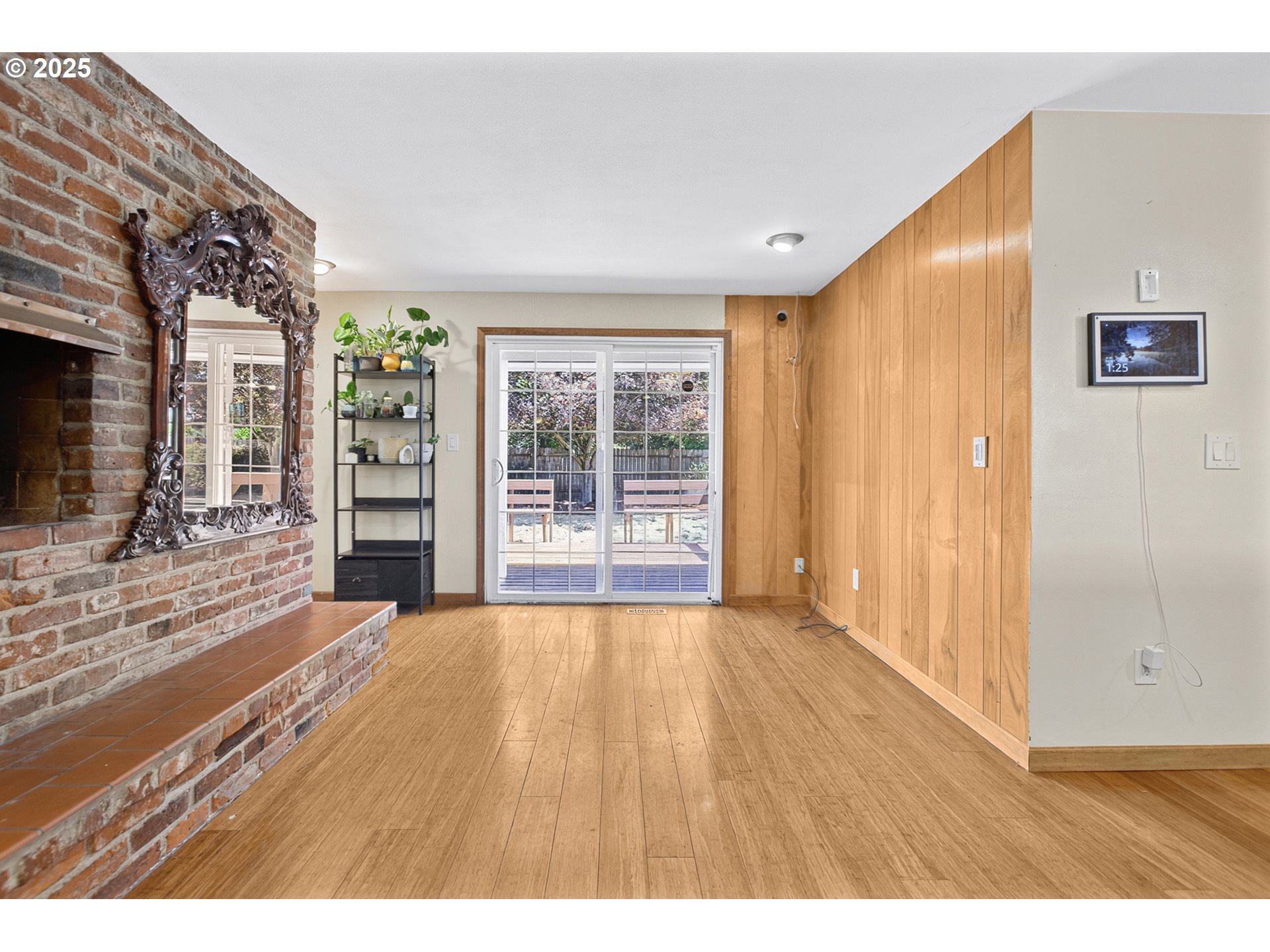 457 Archie Street Eugene, OR 97402 - Photo 4 of 48 a view of an empty room with wooden floor and a window