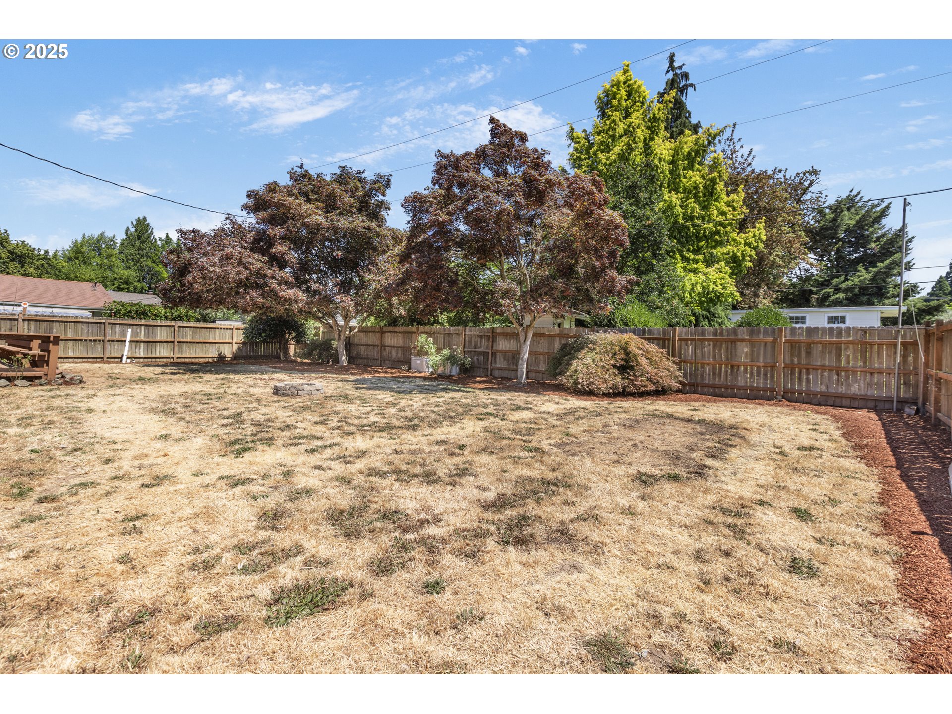 457 Archie Street Eugene, OR 97402 - Photo 41 of 48 a backyard of a house with table and chairs