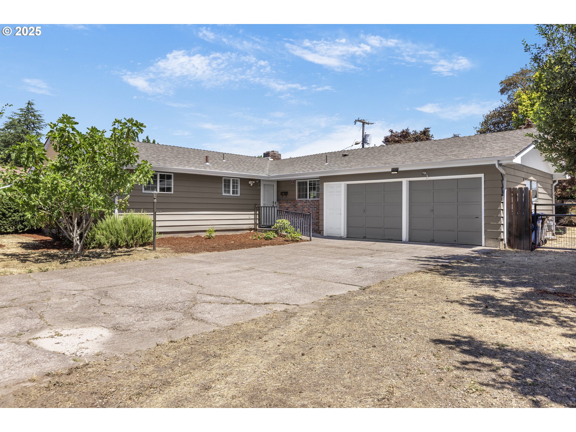 457 Archie Street Eugene, OR 97402 - Photo 48 of 48 a front view of a house with a yard and a garage