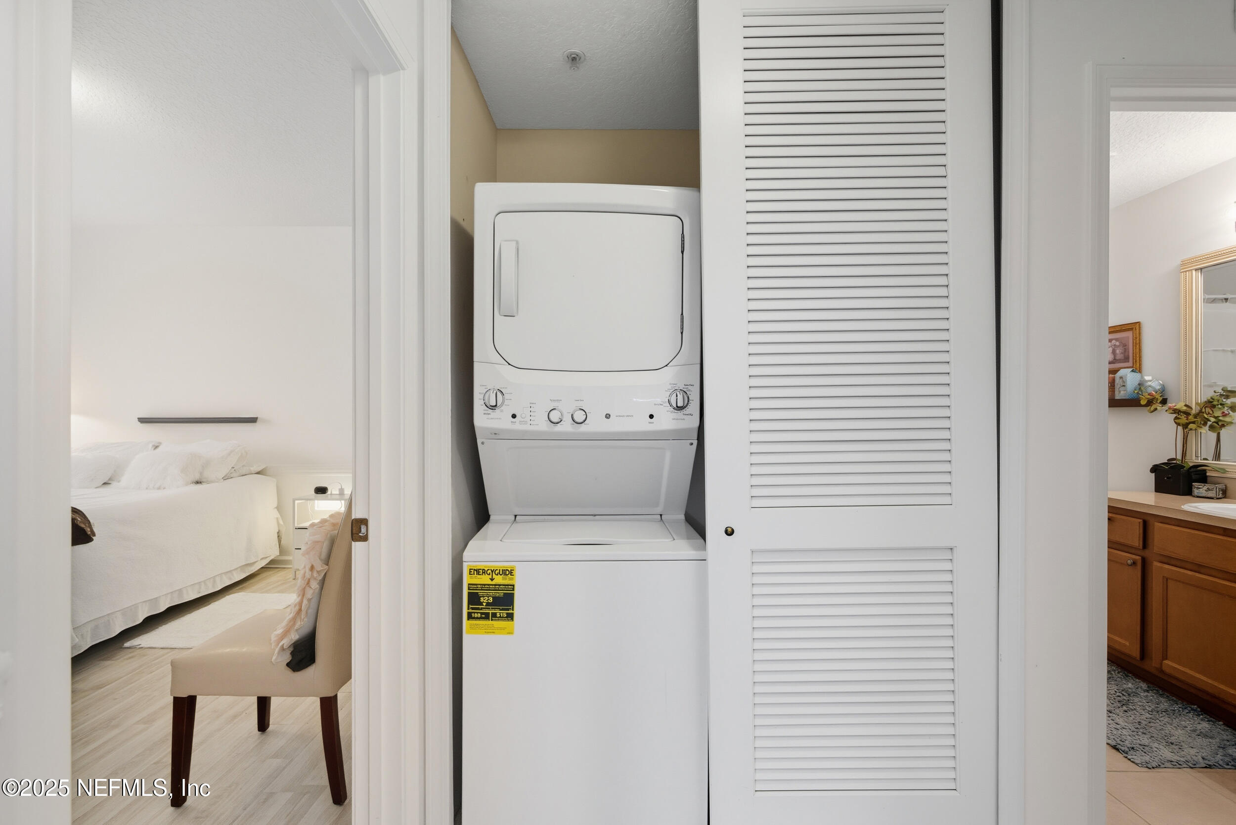 575 Oakleaf Plantation Parkway, Unit 1004 Orange Park, FL 32065 - Photo 11 of 22 a utility room with dryer and washer
