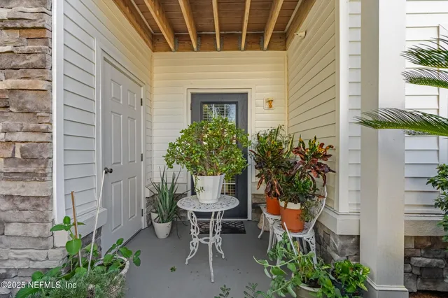 a view of a chair and table in the patio
