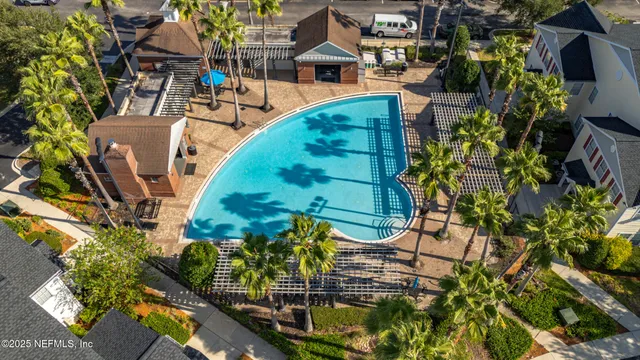 a view of swimming pool with sitting area