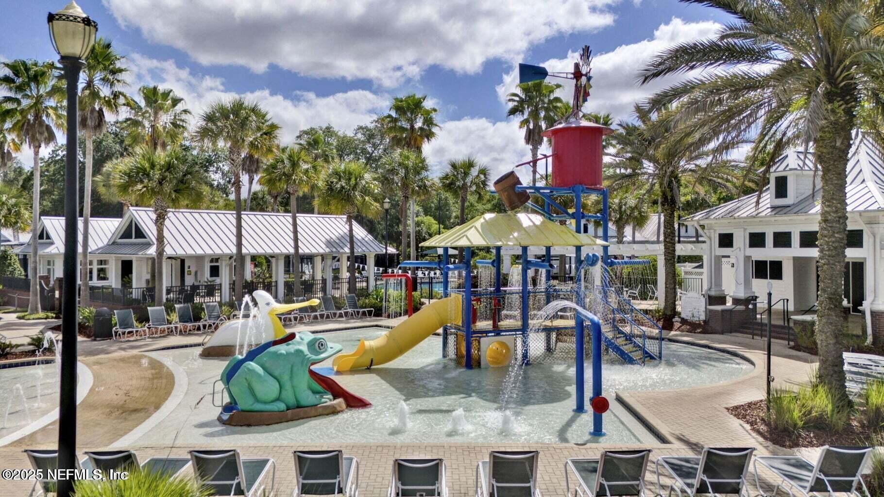 575 Oakleaf Plantation Parkway, Unit 1004 Orange Park, FL 32065 - Photo 19 of 22 a view of a swimming pool with a patio