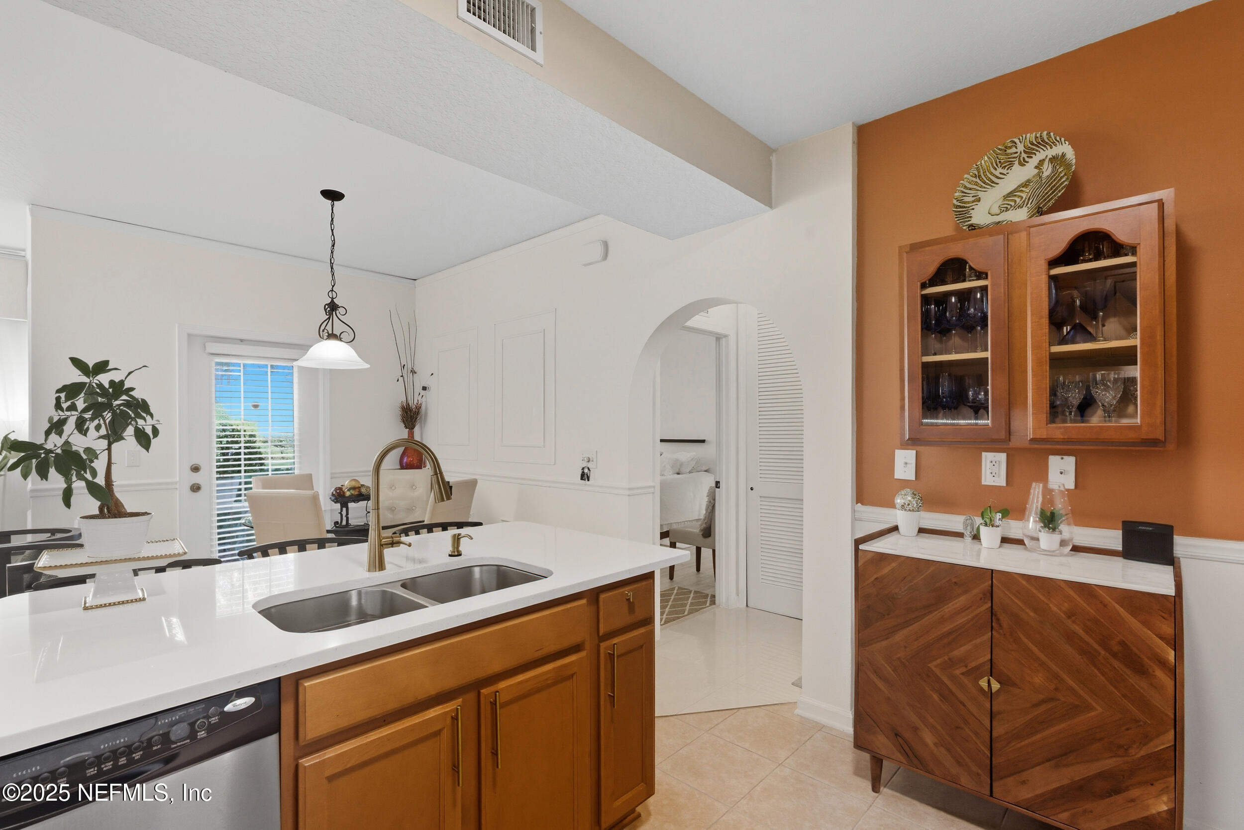 575 Oakleaf Plantation Parkway, Unit 1004 Orange Park, FL 32065 - Photo 2 of 22 a bathroom with a sink double vanity and a mirror