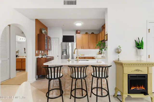 a view of a kitchen with furniture and a fireplace
