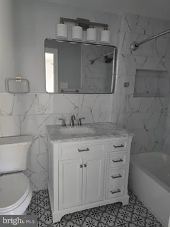 a kitchen with appliances a sink and cabinets