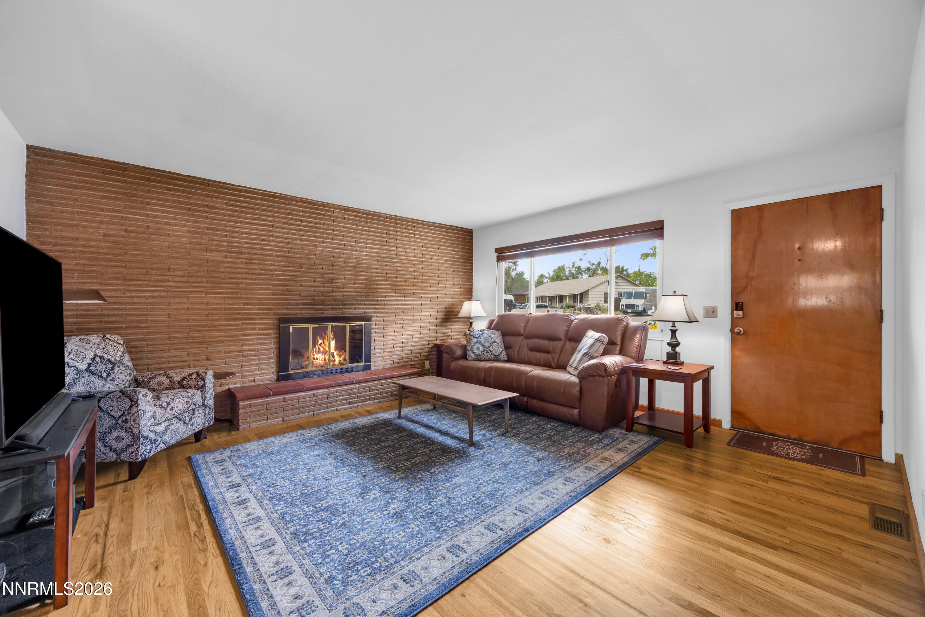 1208 Charles Drive Reno, NV 89509 - Photo 11 of 36 a living room with furniture and a fireplace