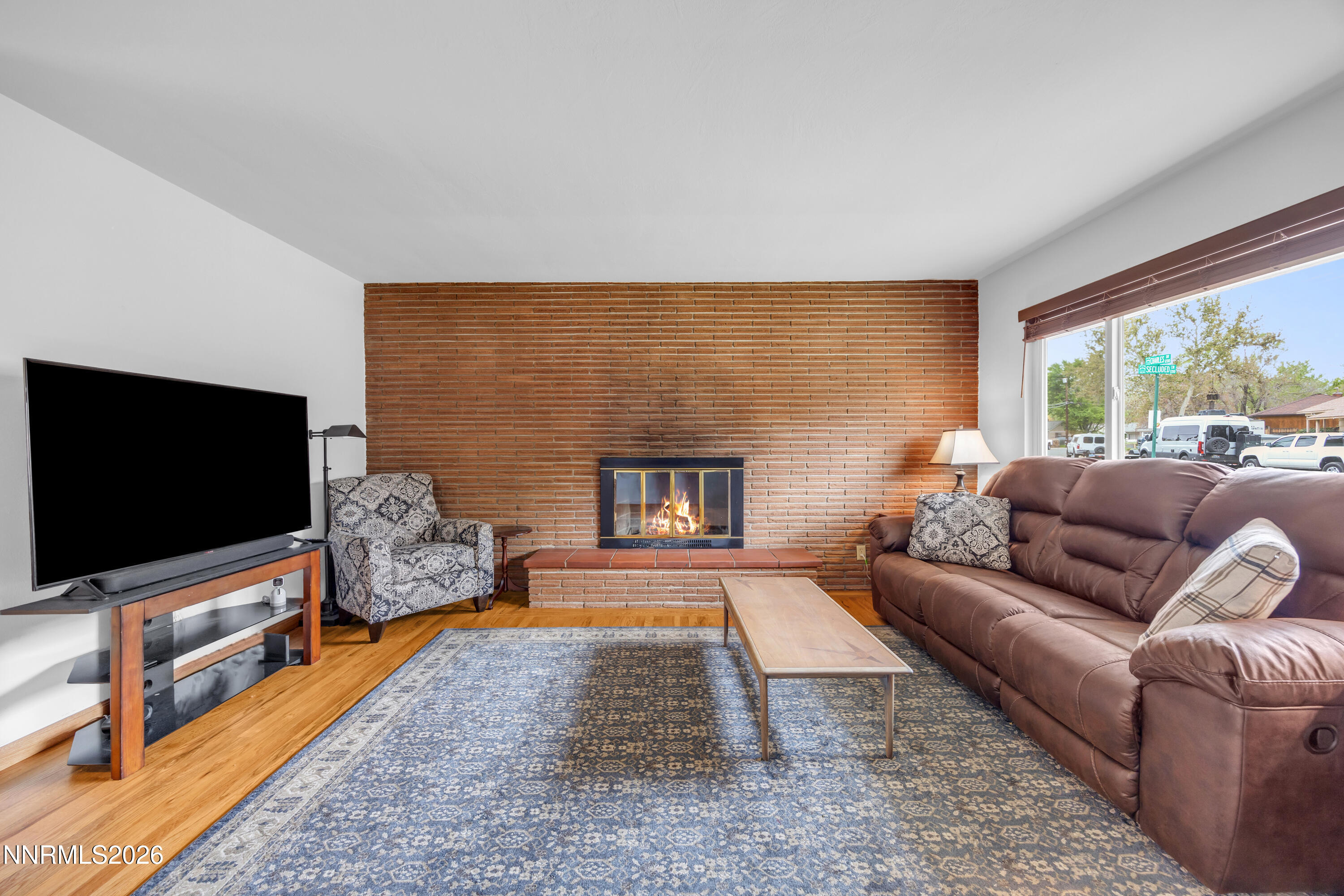 1208 Charles Drive Reno, NV 89509 - Photo 12 of 36 a living room with furniture and a flat screen tv