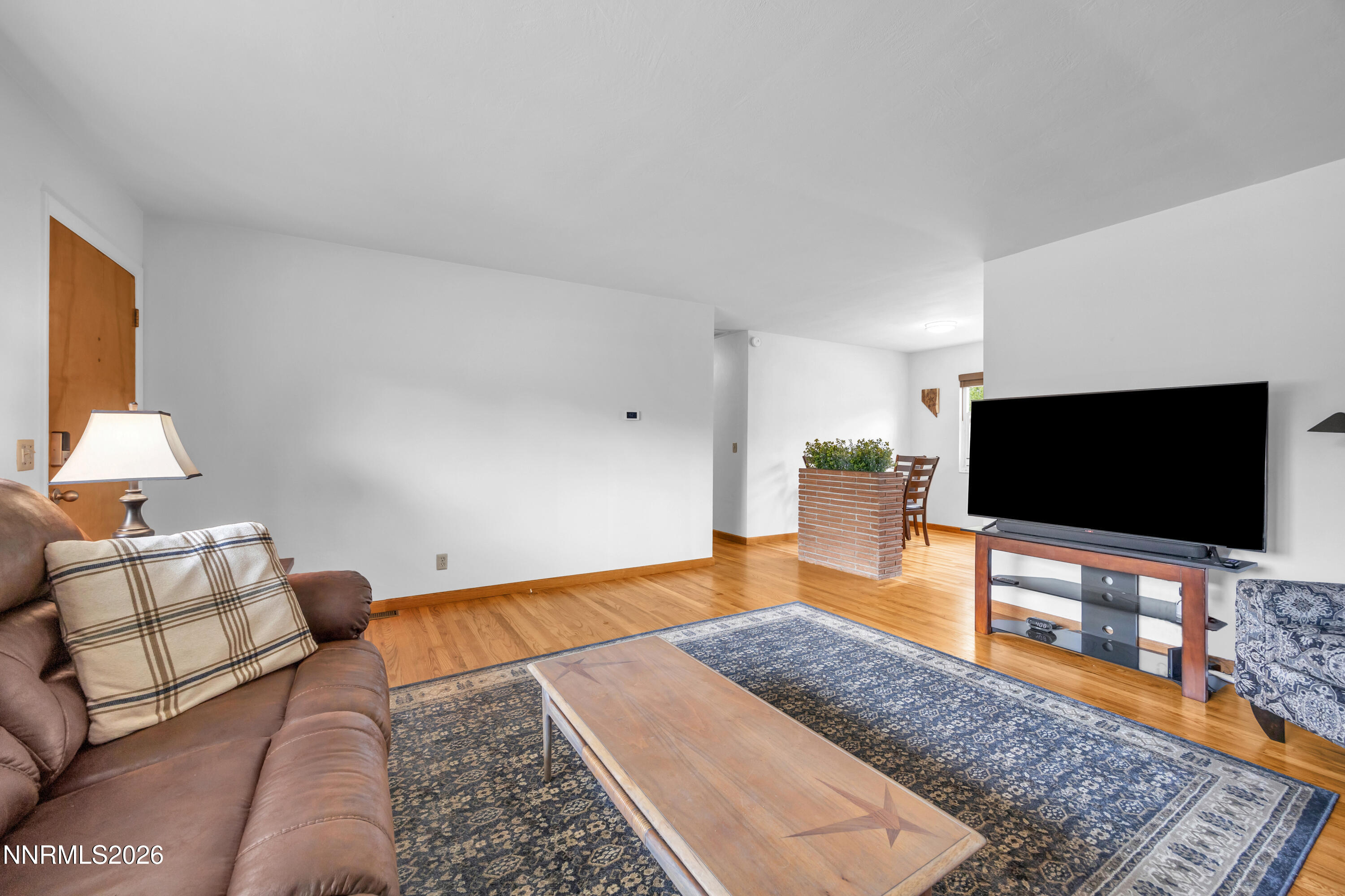 1208 Charles Drive Reno, NV 89509 - Photo 13 of 36 a living room with furniture and a flat screen tv