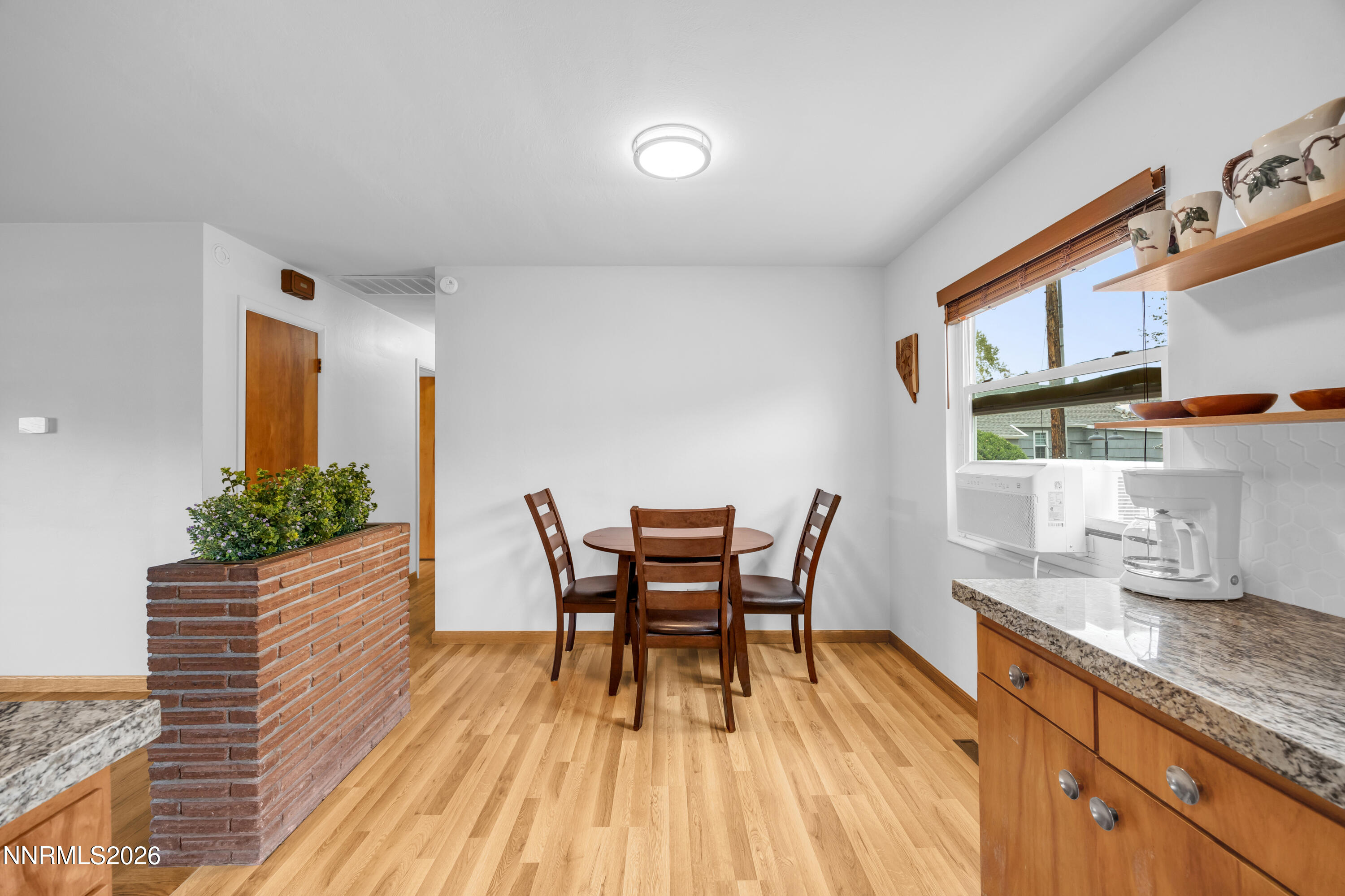 1208 Charles Drive Reno, NV 89509 - Photo 16 of 36 a dining room with furniture and wooden floor