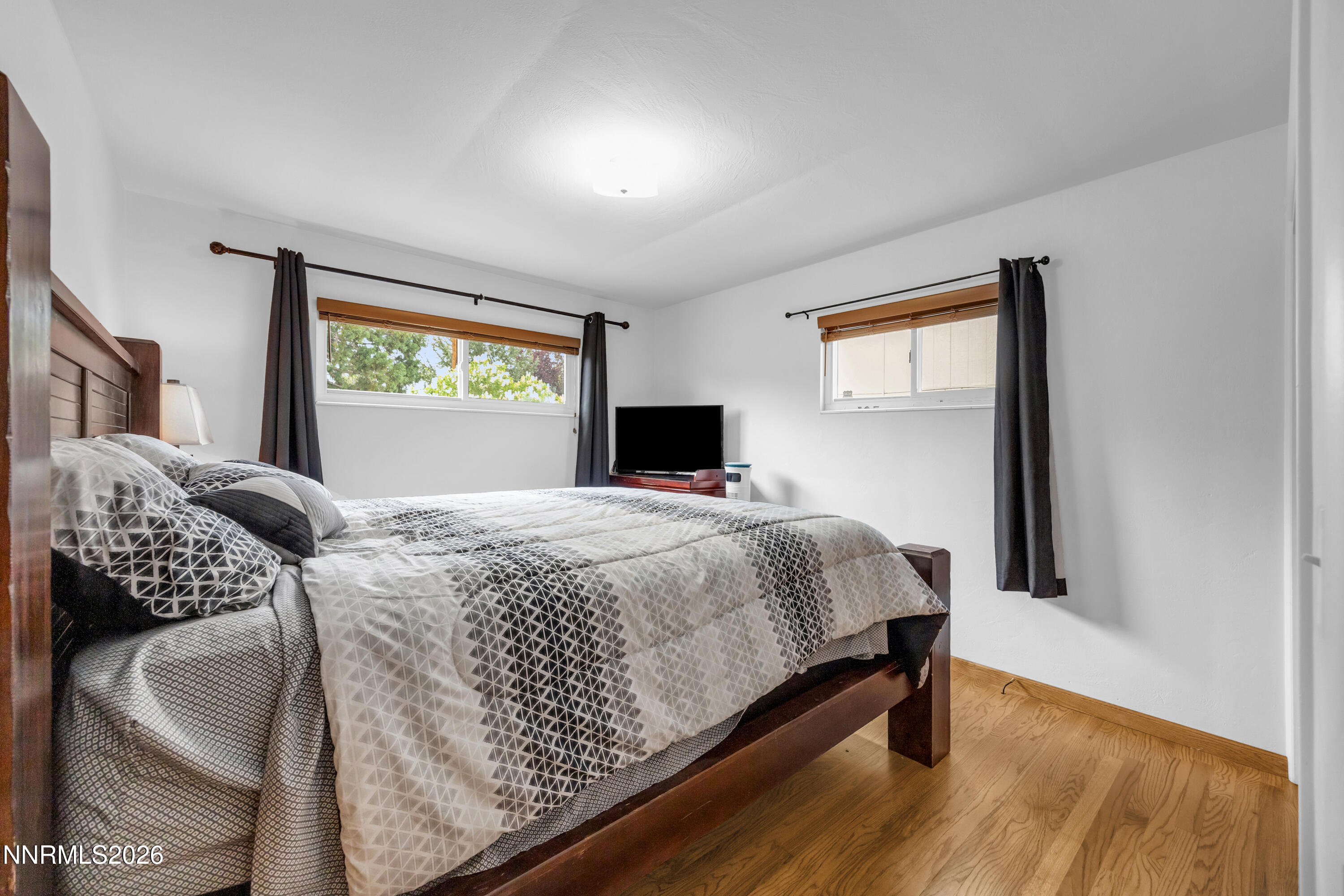 1208 Charles Drive Reno, NV 89509 - Photo 23 of 36 a bedroom with a bed and window