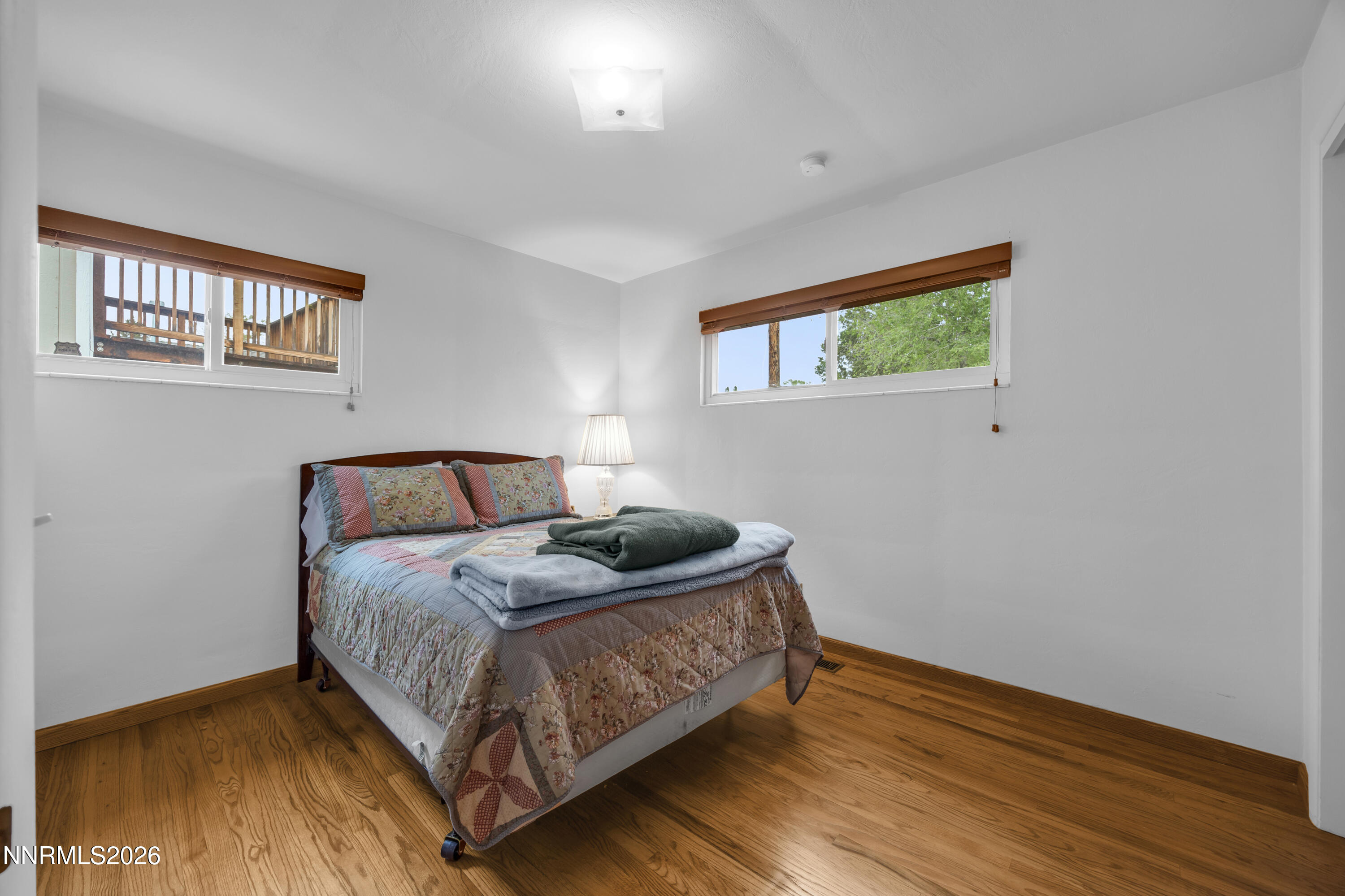1208 Charles Drive Reno, NV 89509 - Photo 25 of 36 a bedroom with a bed and wooden floor