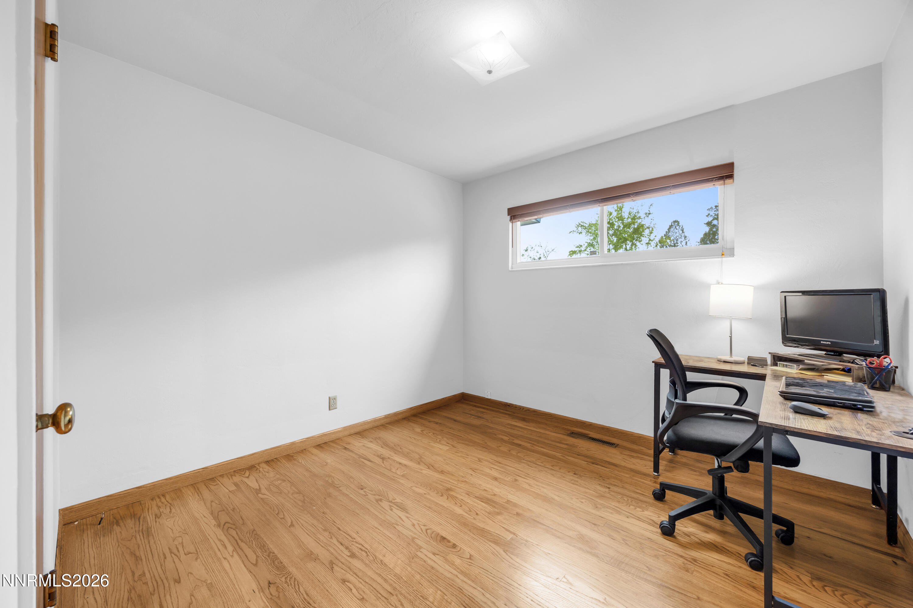 1208 Charles Drive Reno, NV 89509 - Photo 27 of 36 a view of room with hardwood floor and cabinet