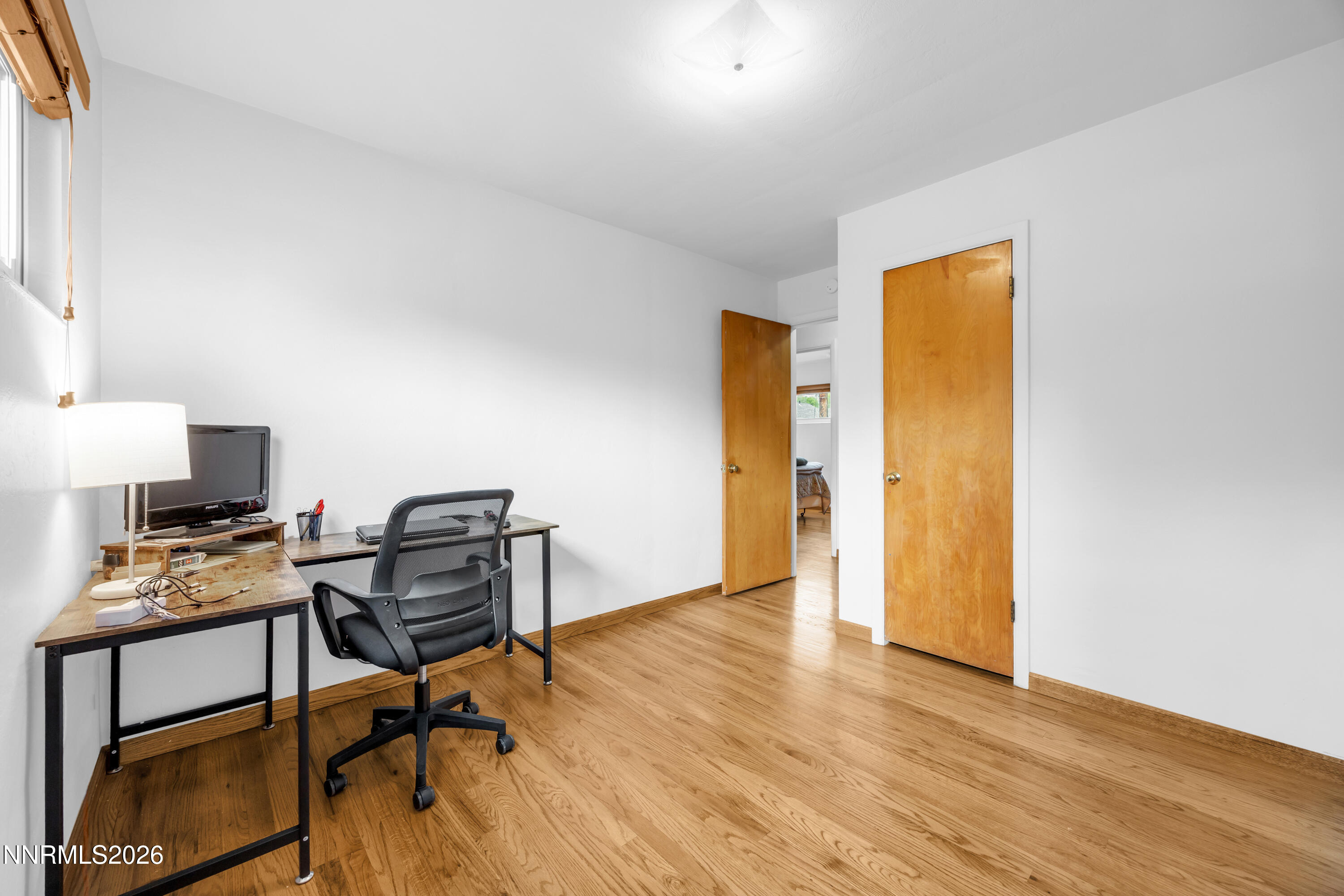 1208 Charles Drive Reno, NV 89509 - Photo 28 of 36 a workspace with furniture and wooden floor