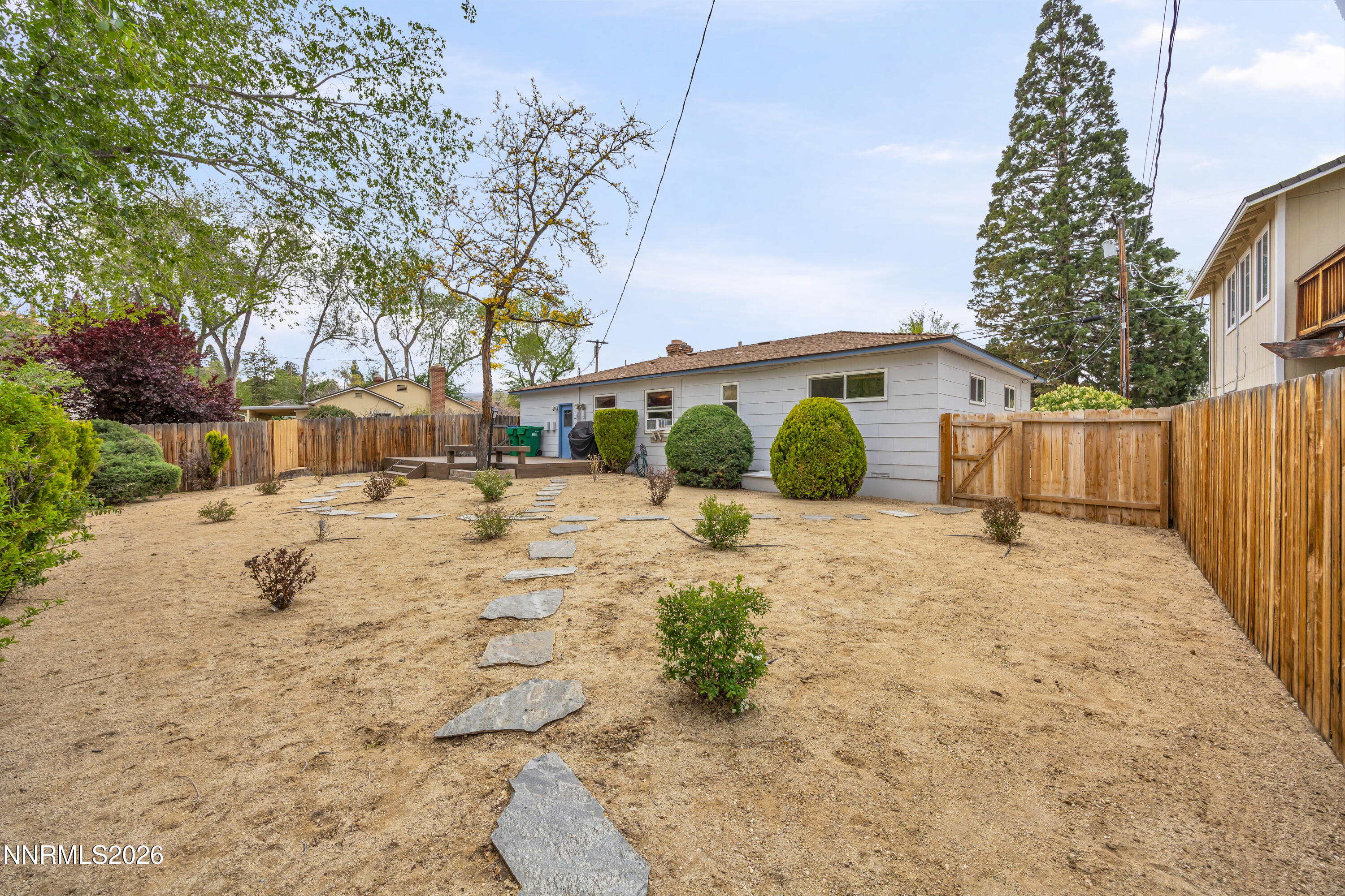 1208 Charles Drive Reno, NV 89509 - Photo 31 of 36 a front view of a house with a yard and garage